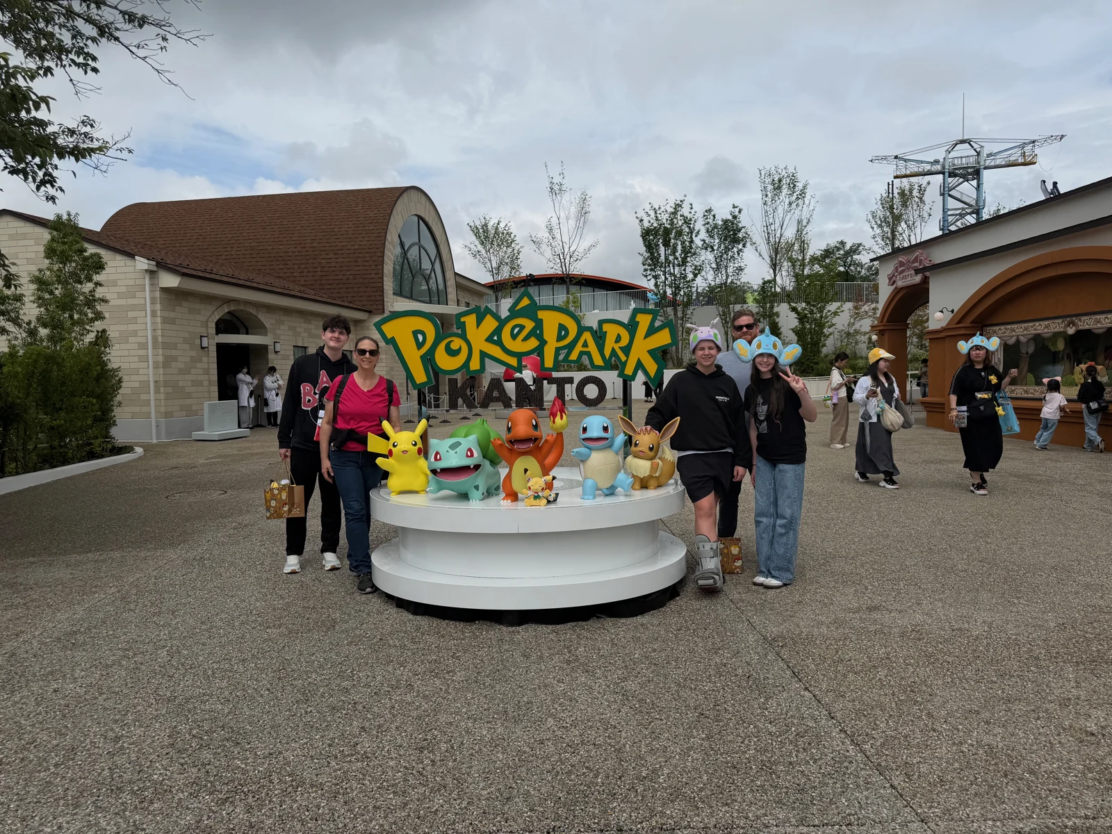 All five of us at the PokéPark Kanto sign at Yomiuriland.