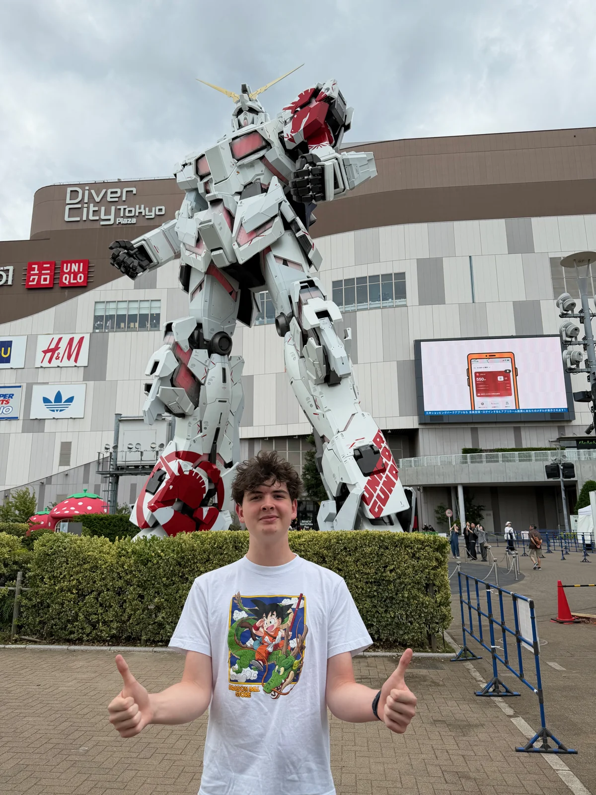 Wesley standing in front of the giant Gundam at DiverCity.