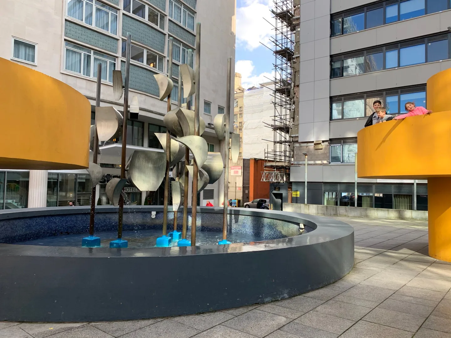 Fountain surrounded by modern buildings