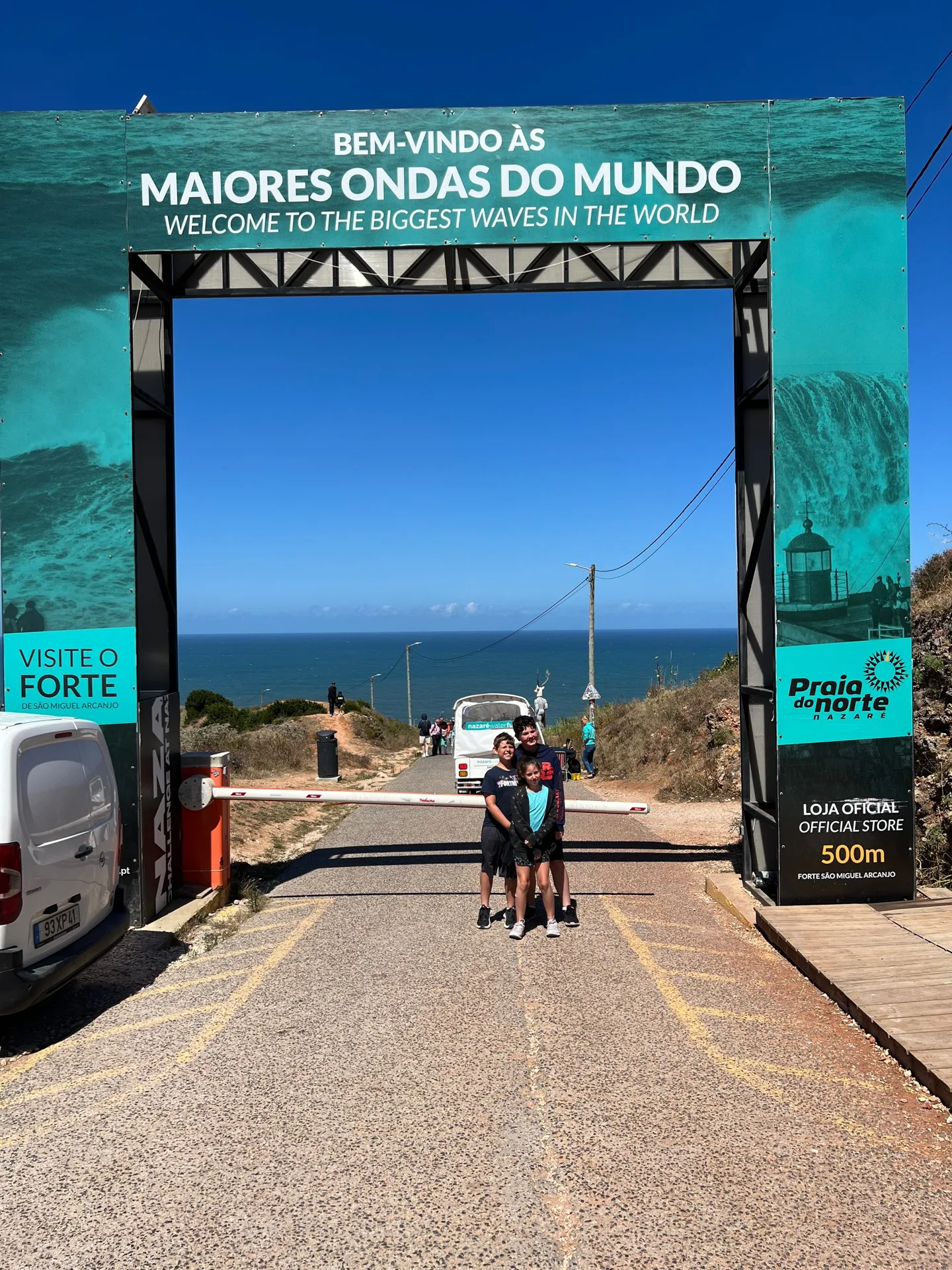Children beneath a gateway at Nazaré