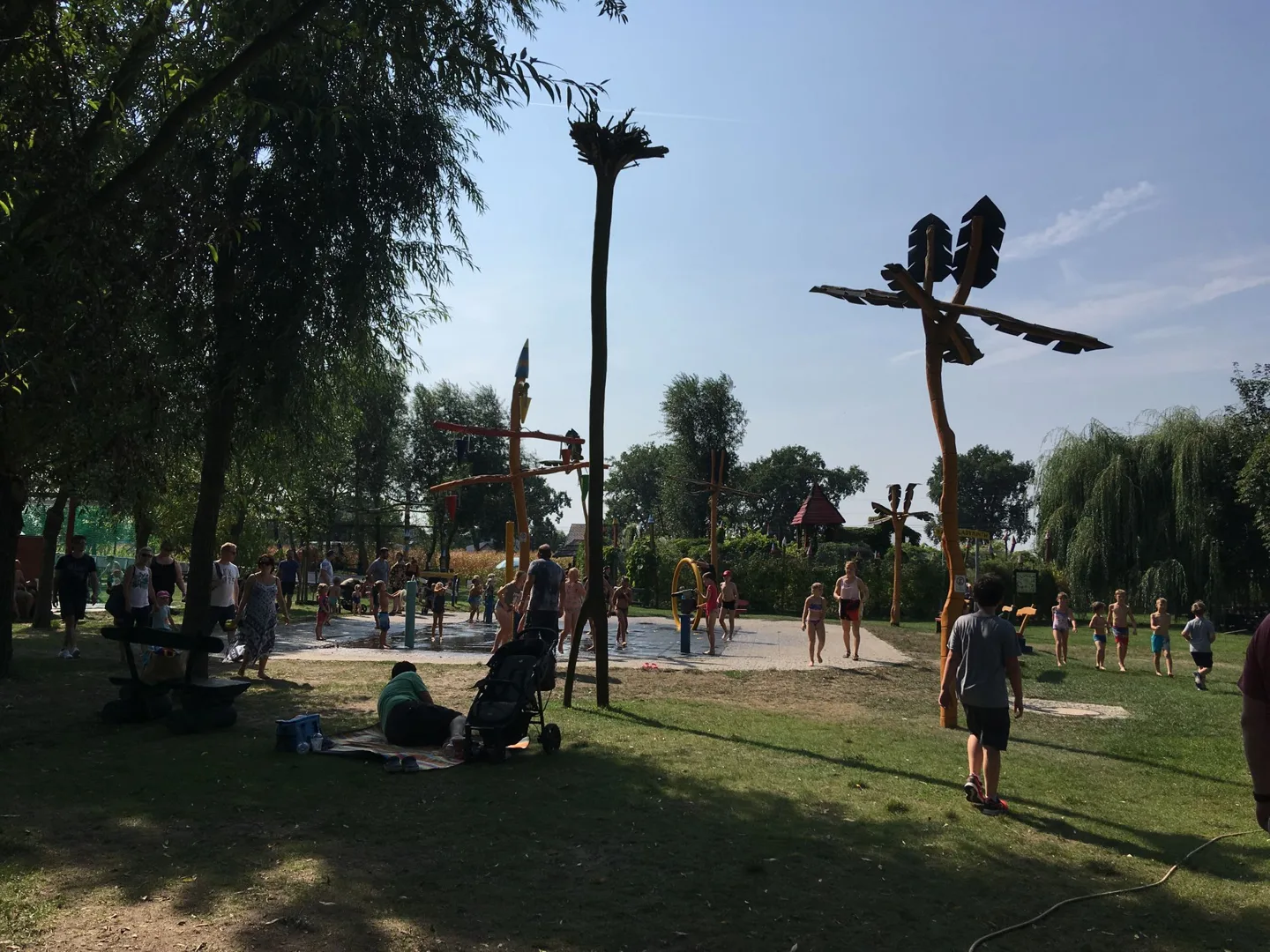 Children using outdoor climbing equipment
