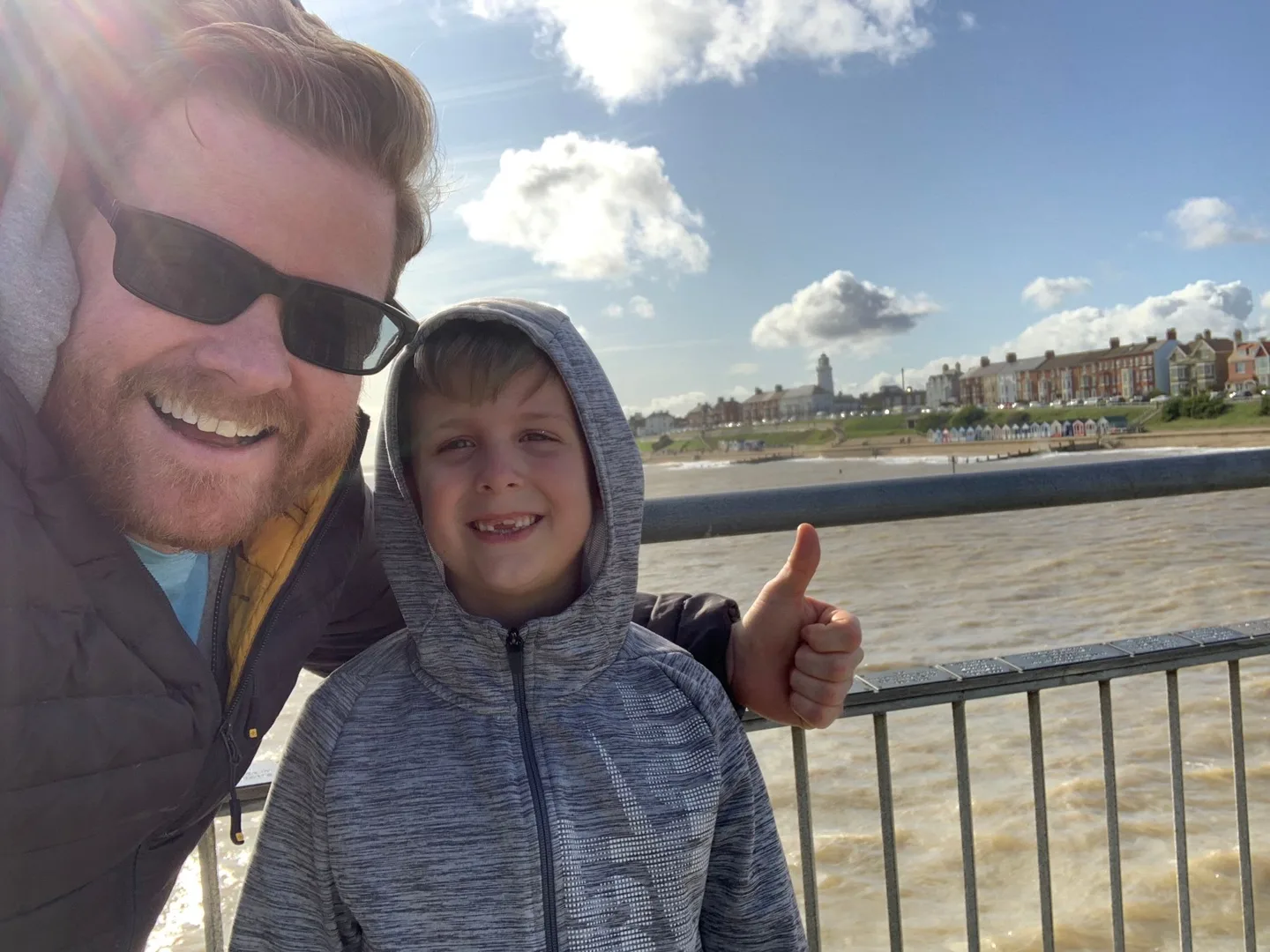 Father and child beside the water