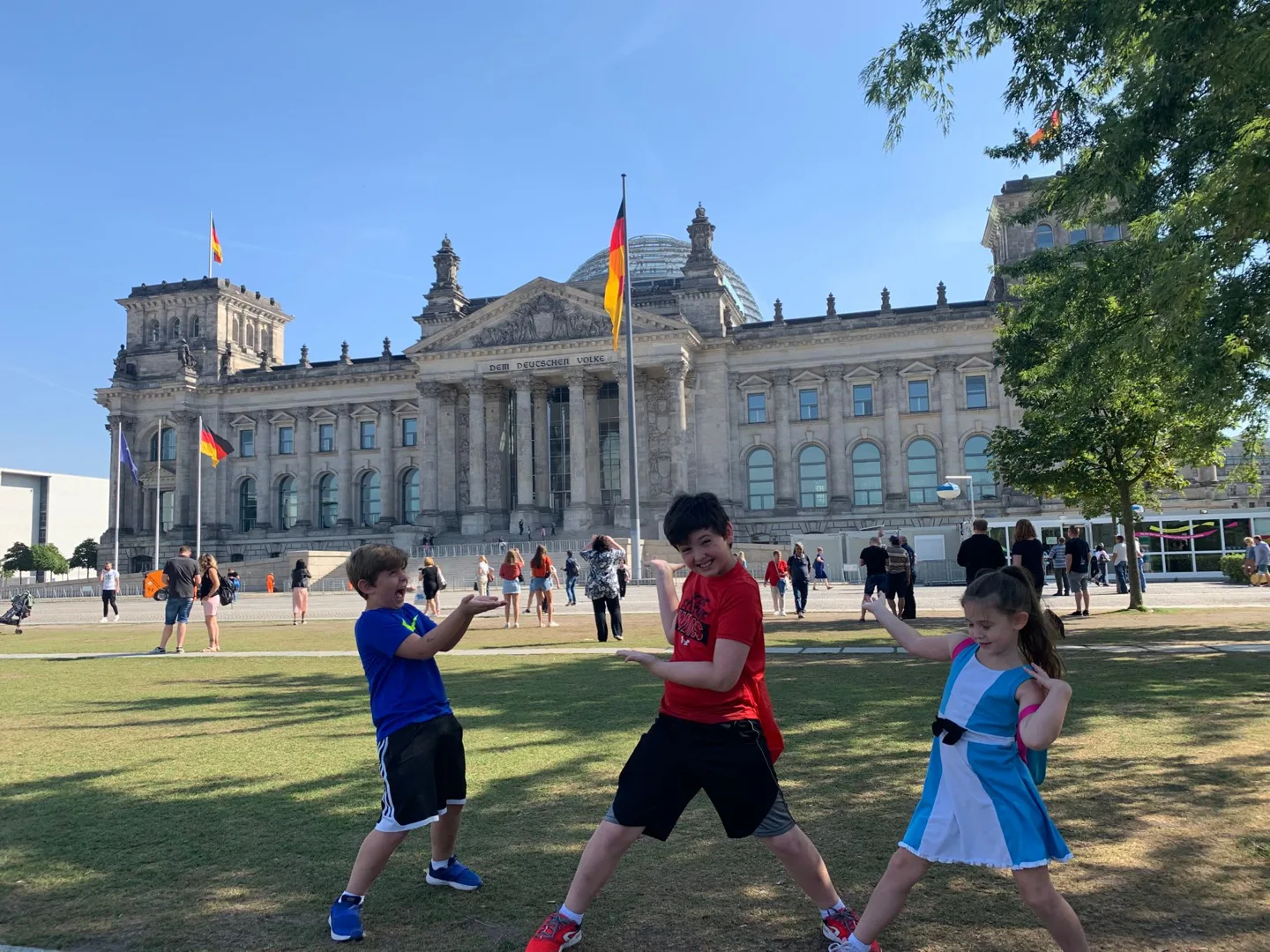 Children playing on the lawn outside the Reichstag