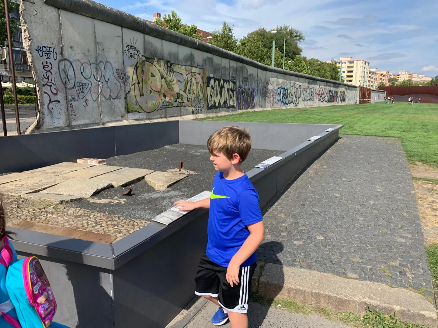 Child beside a display at the Berlin Wall memorial