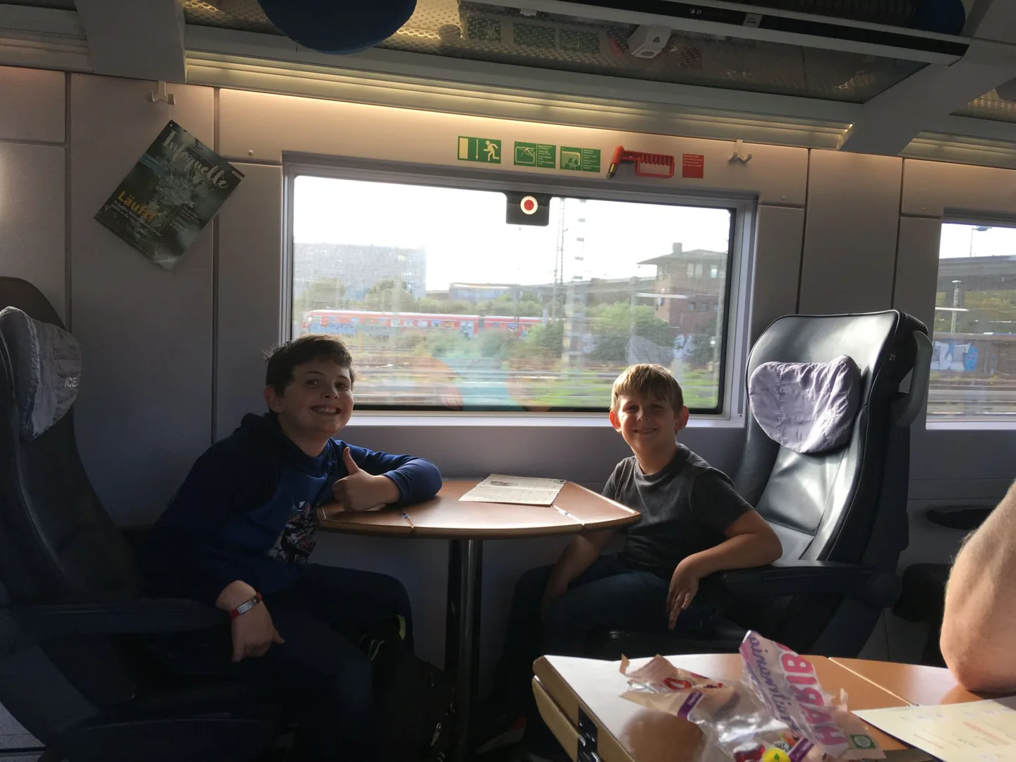 Family seated together on a train