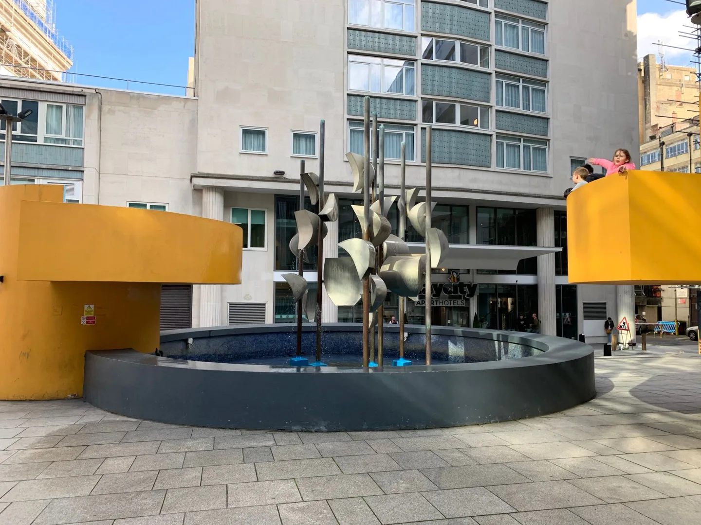 Fountain and sculpture in a city courtyard