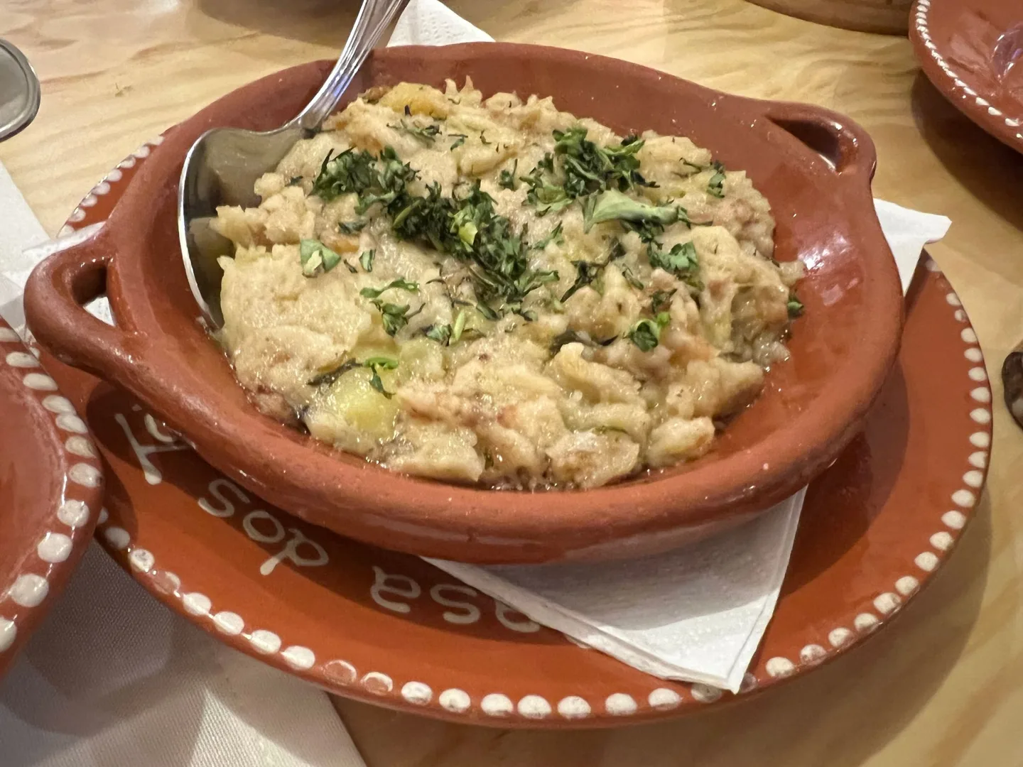 Rice dish served in a terracotta bowl