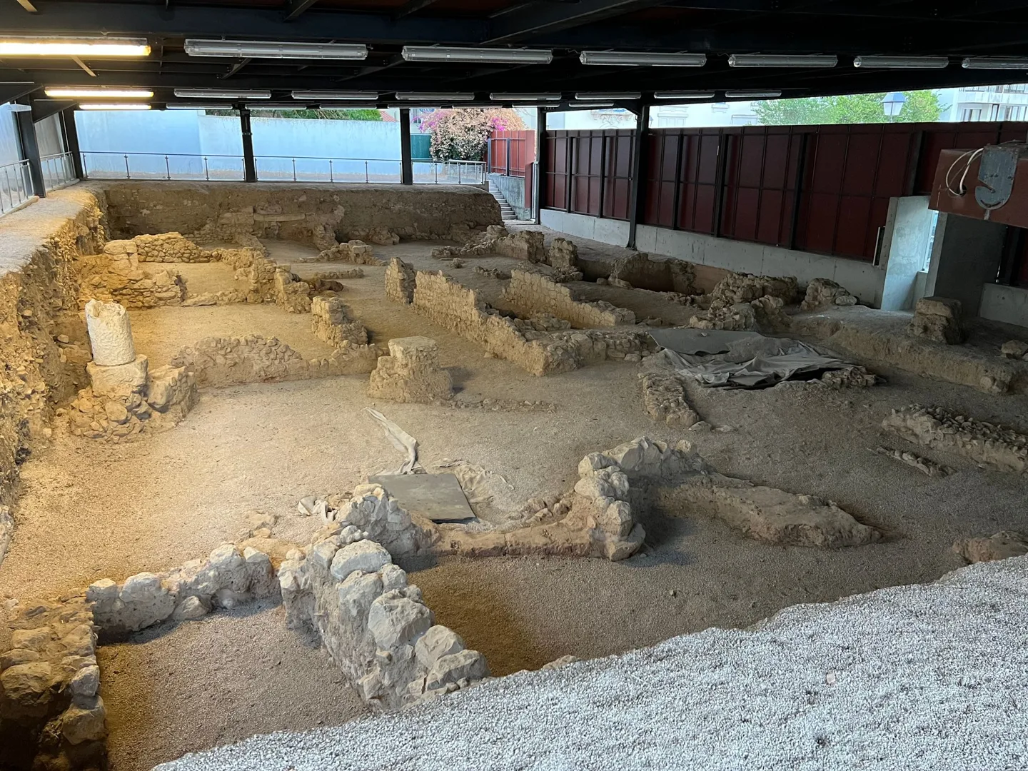 Excavated foundations beneath a shelter