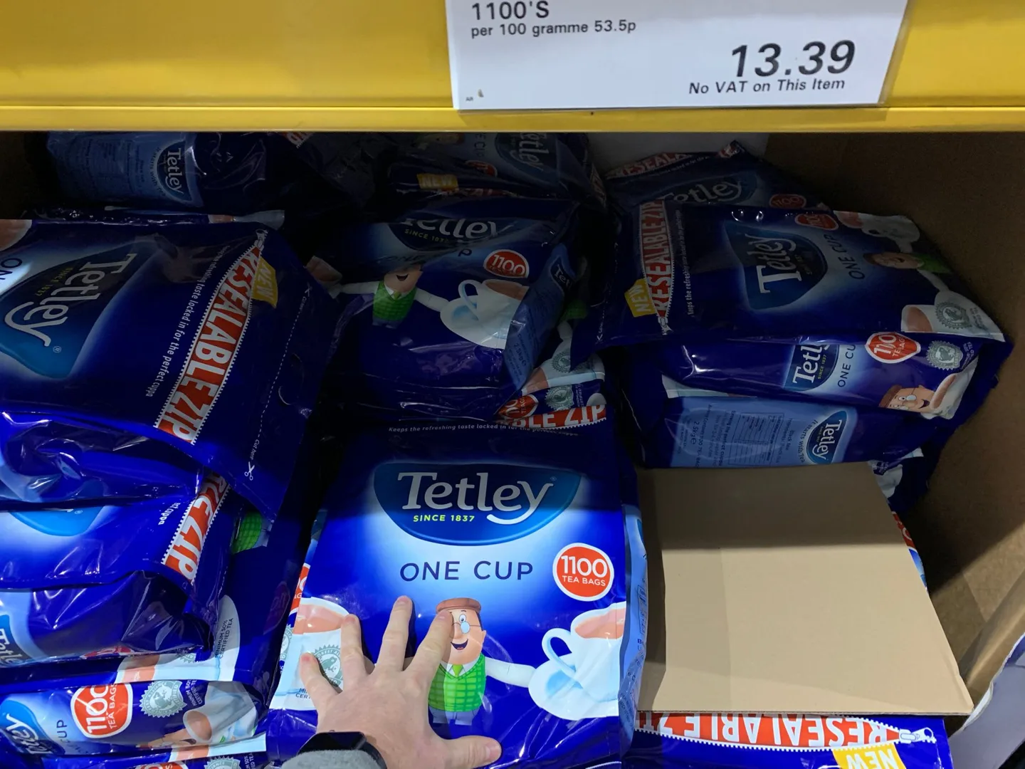 Boxes of Tetley tea on a warehouse shelf