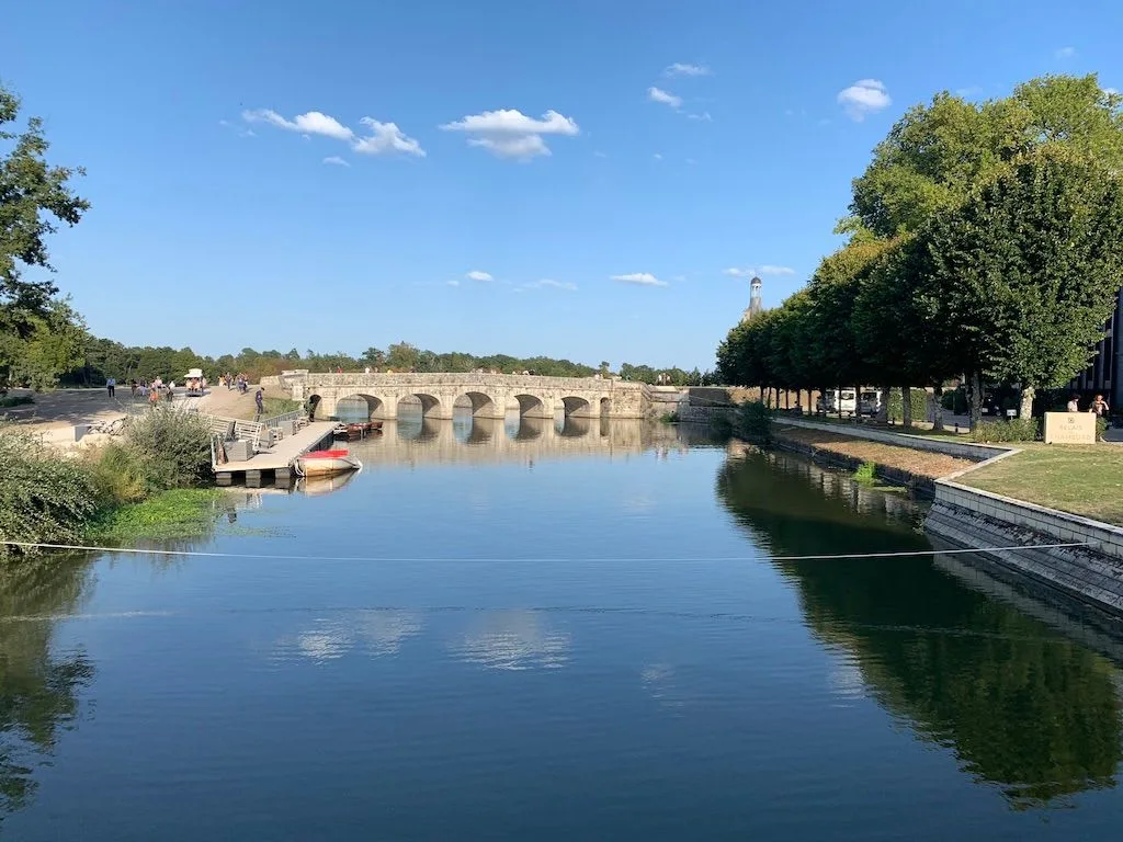 River reflecting a stone bridge