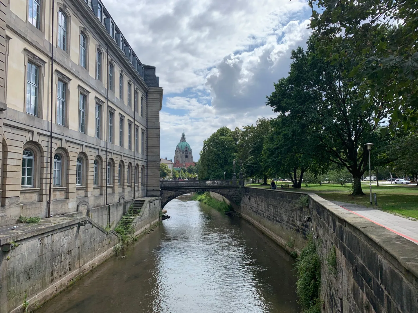 Canal running alongside a stone building
