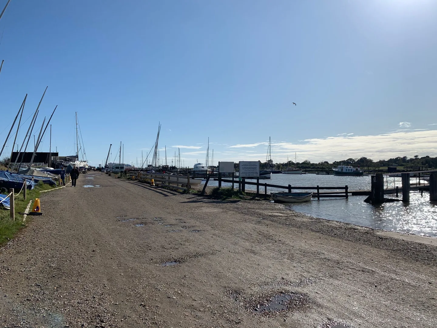 Riverside path beside moored boats