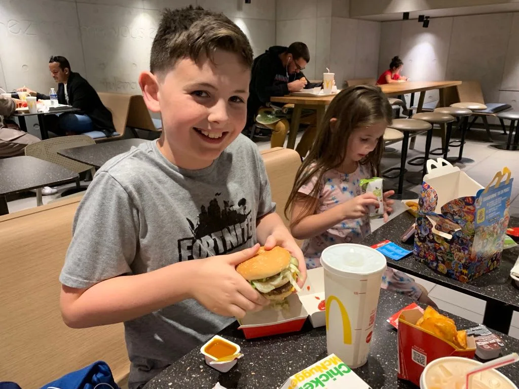 Child eating at a restaurant table
