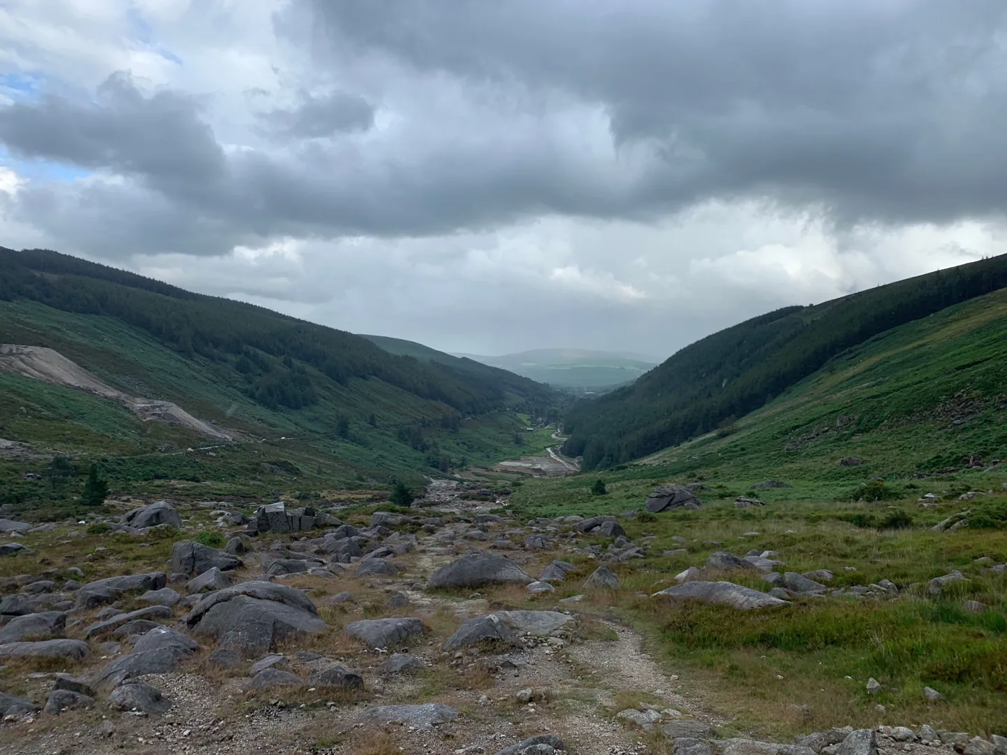 Stream running through a green mountain valley