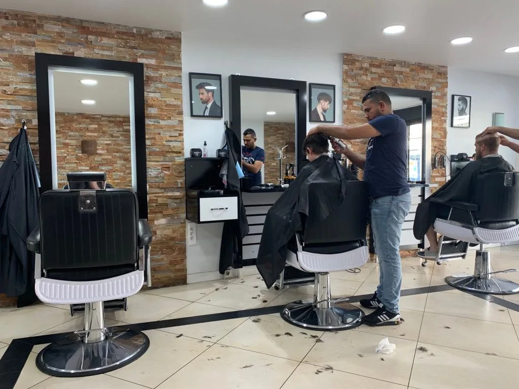 Barbers at work in a bright salon