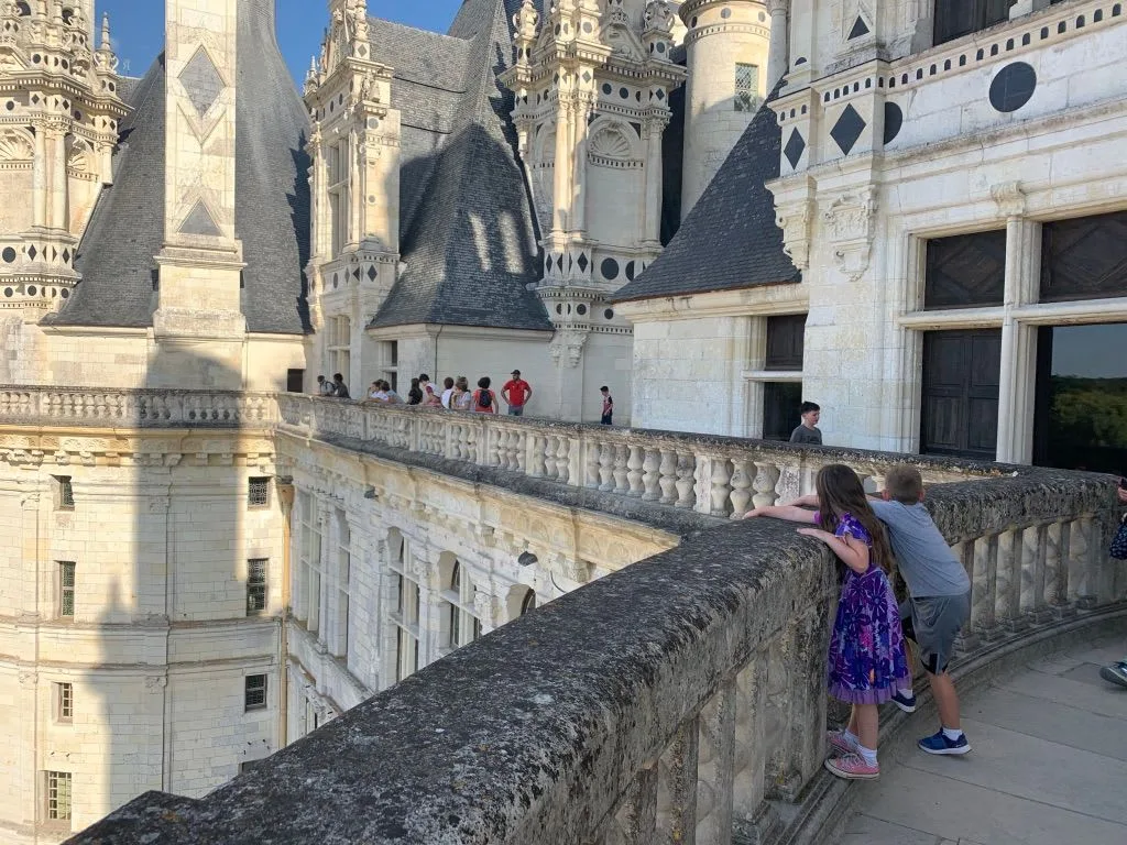Children on a stone terrace at Chambord