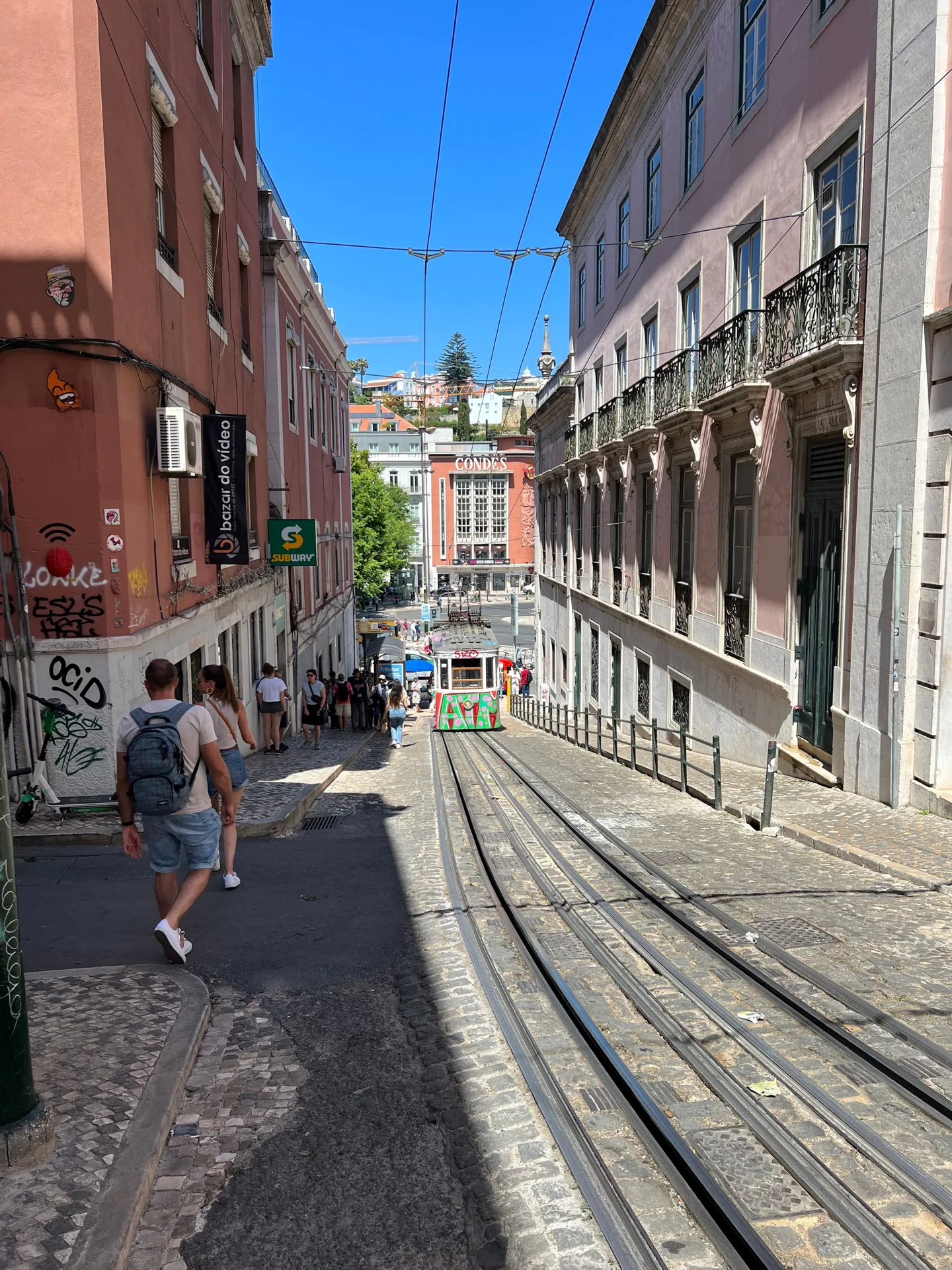 Tram tracks running down a Lisbon street