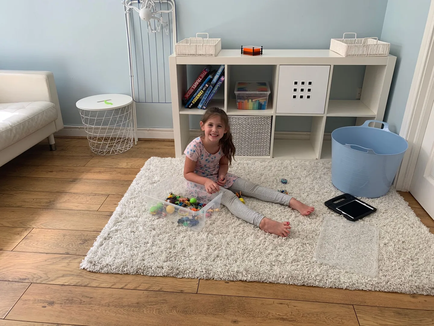 Child playing on a rug in the living room