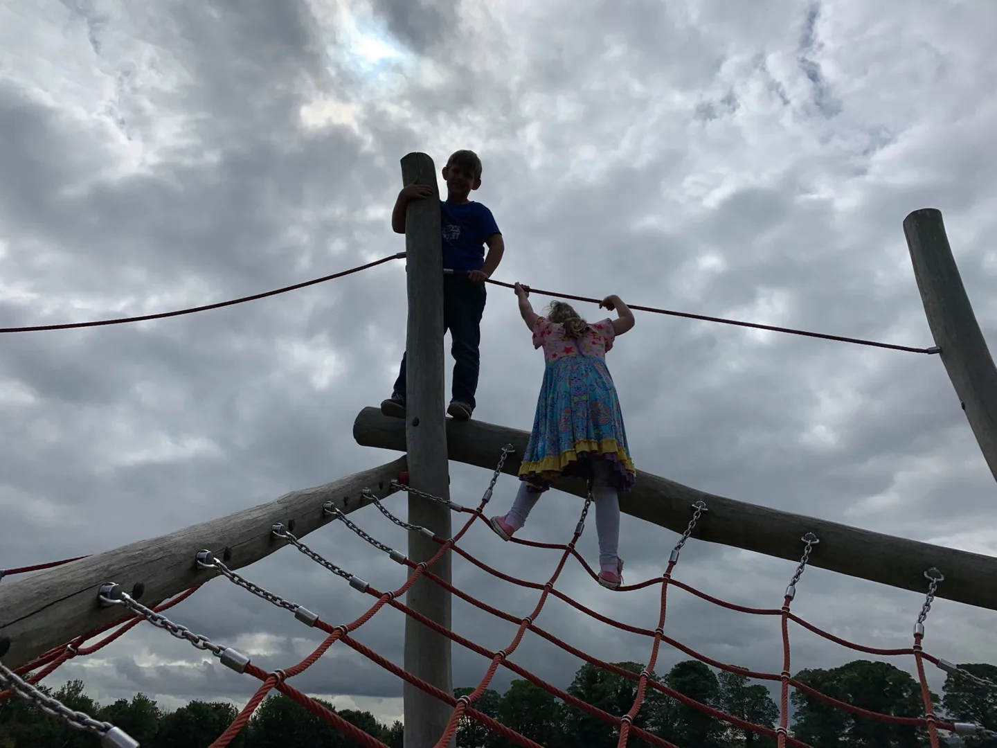 Children climbing a rope playground