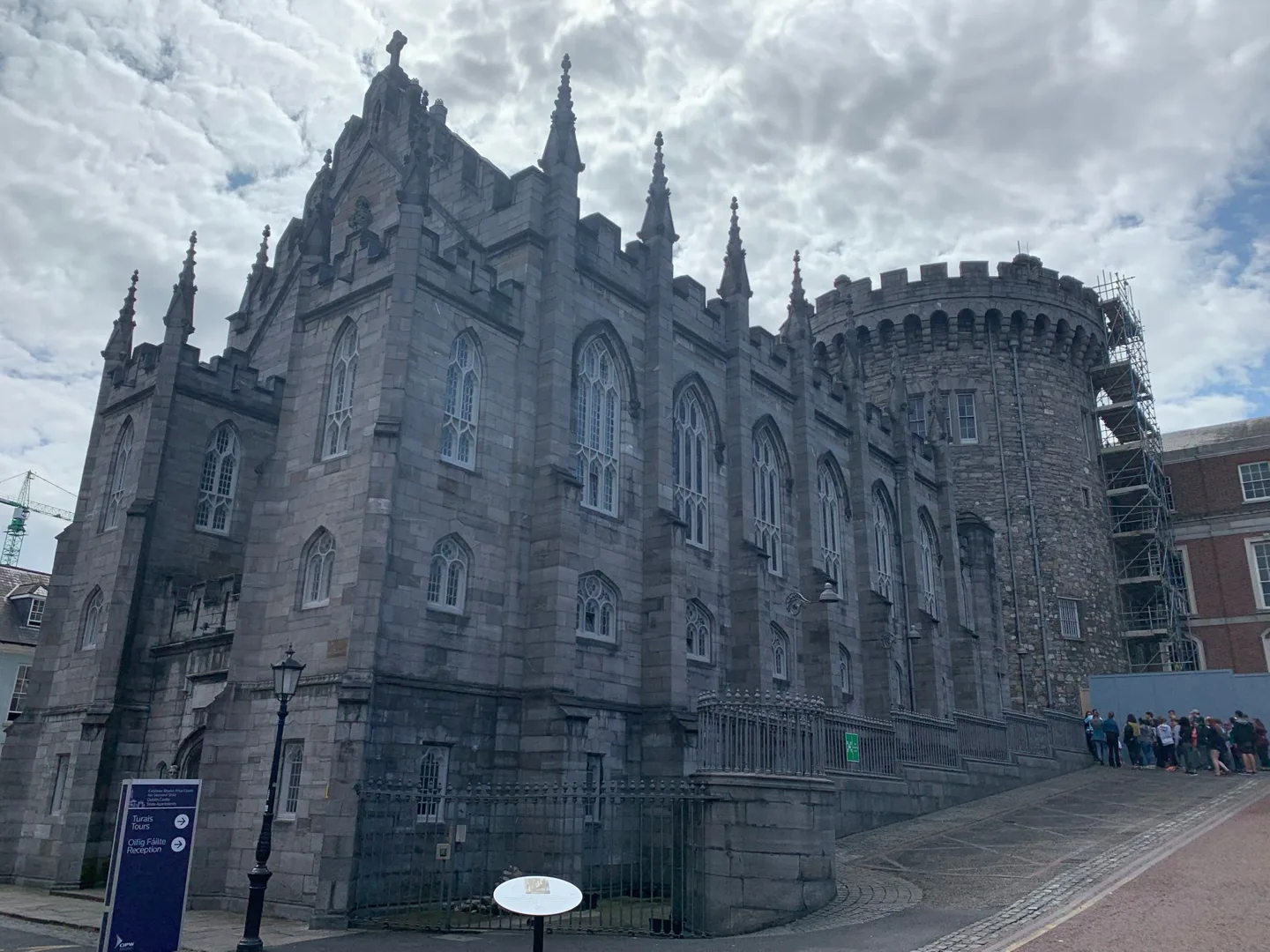 Ornate stone church beneath a cloudy sky
