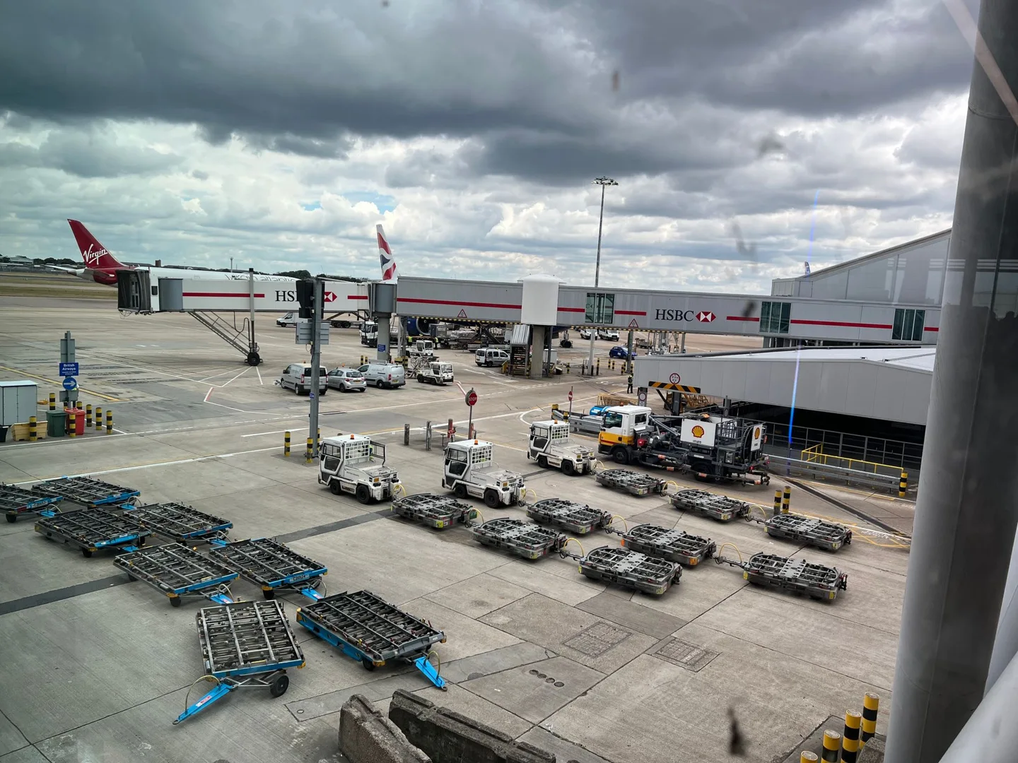 Airport apron and terminal beneath cloudy skies