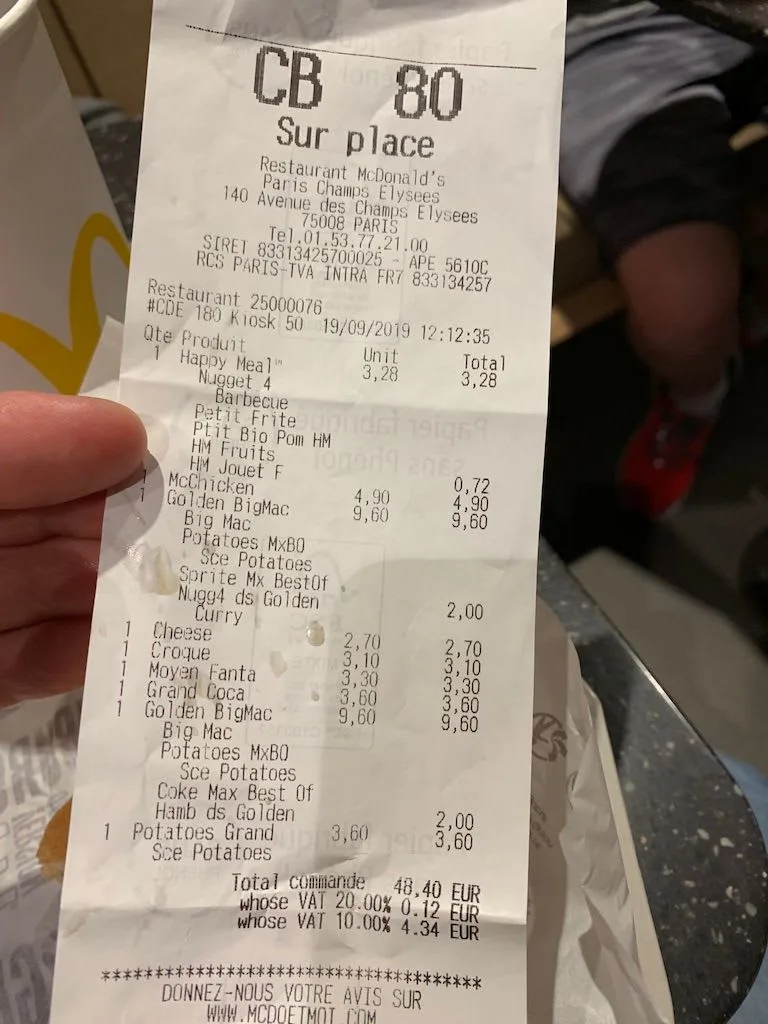 Restaurant receipt held up for the camera