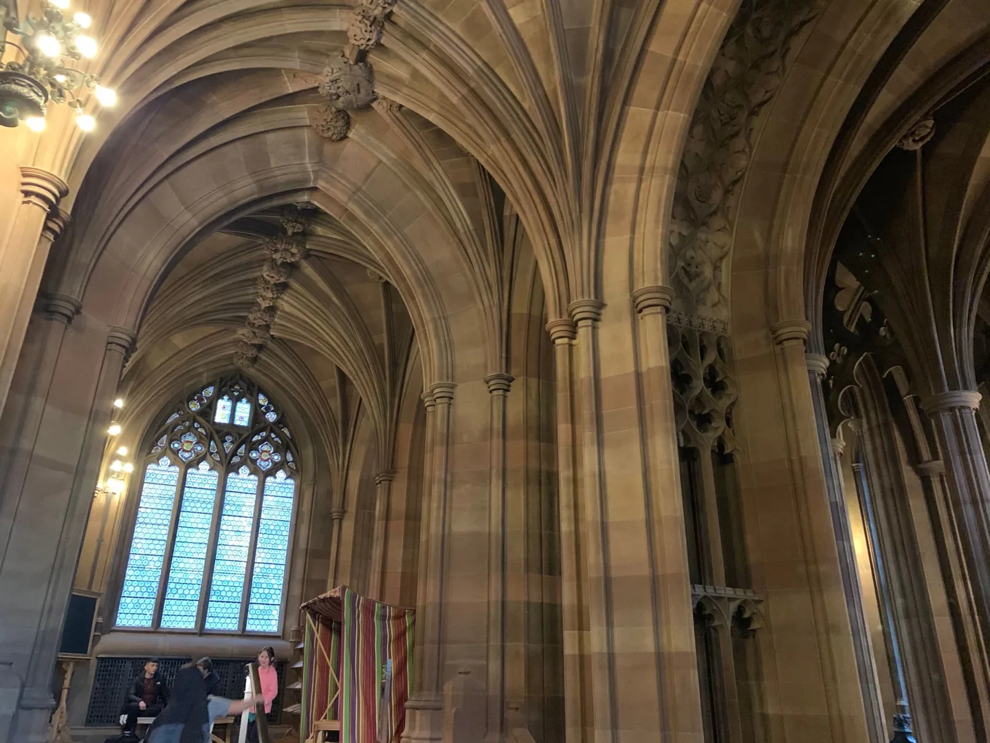 Stained-glass window beneath a vaulted ceiling