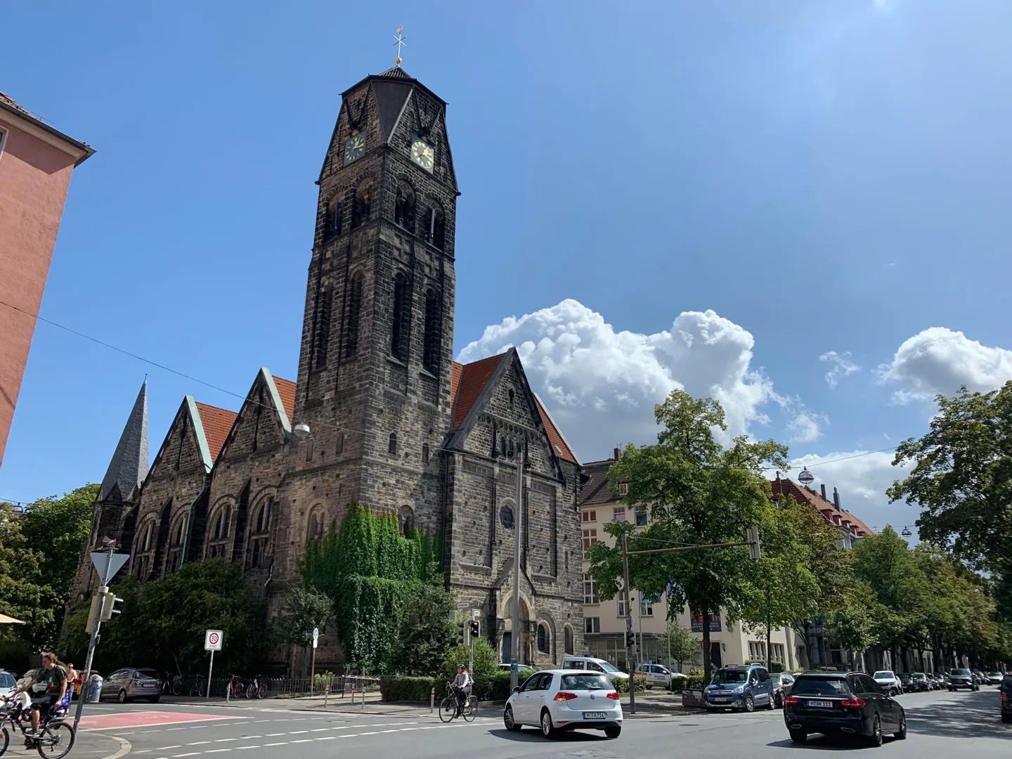 Brick church tower at a street corner