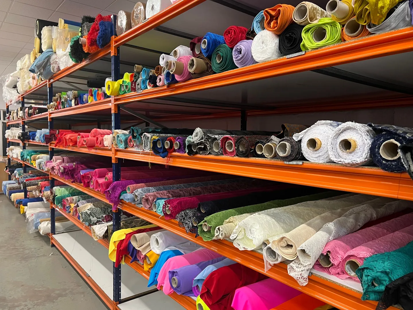 Shelves of colorful fabric rolls