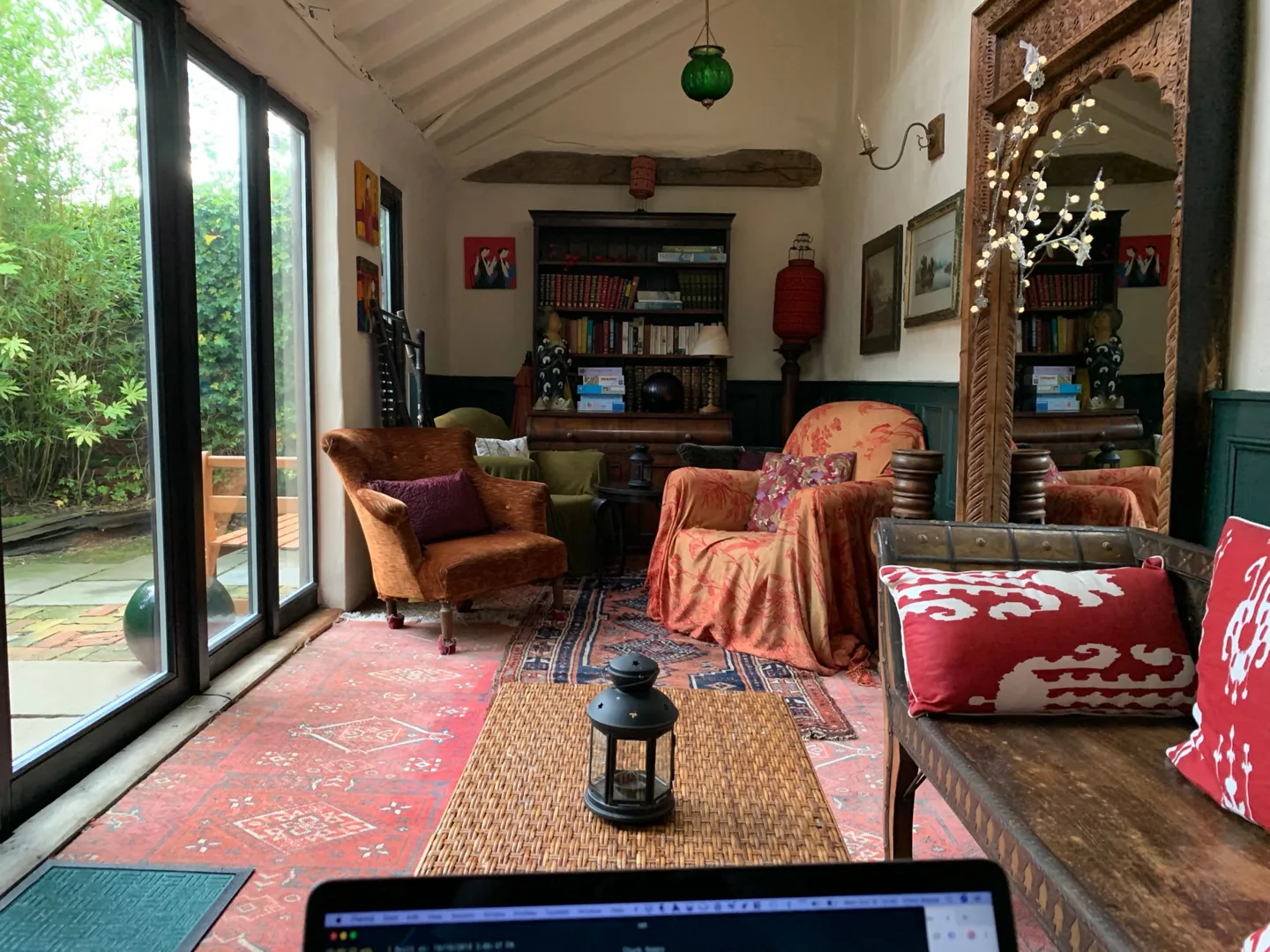 Colorful living room with large garden windows