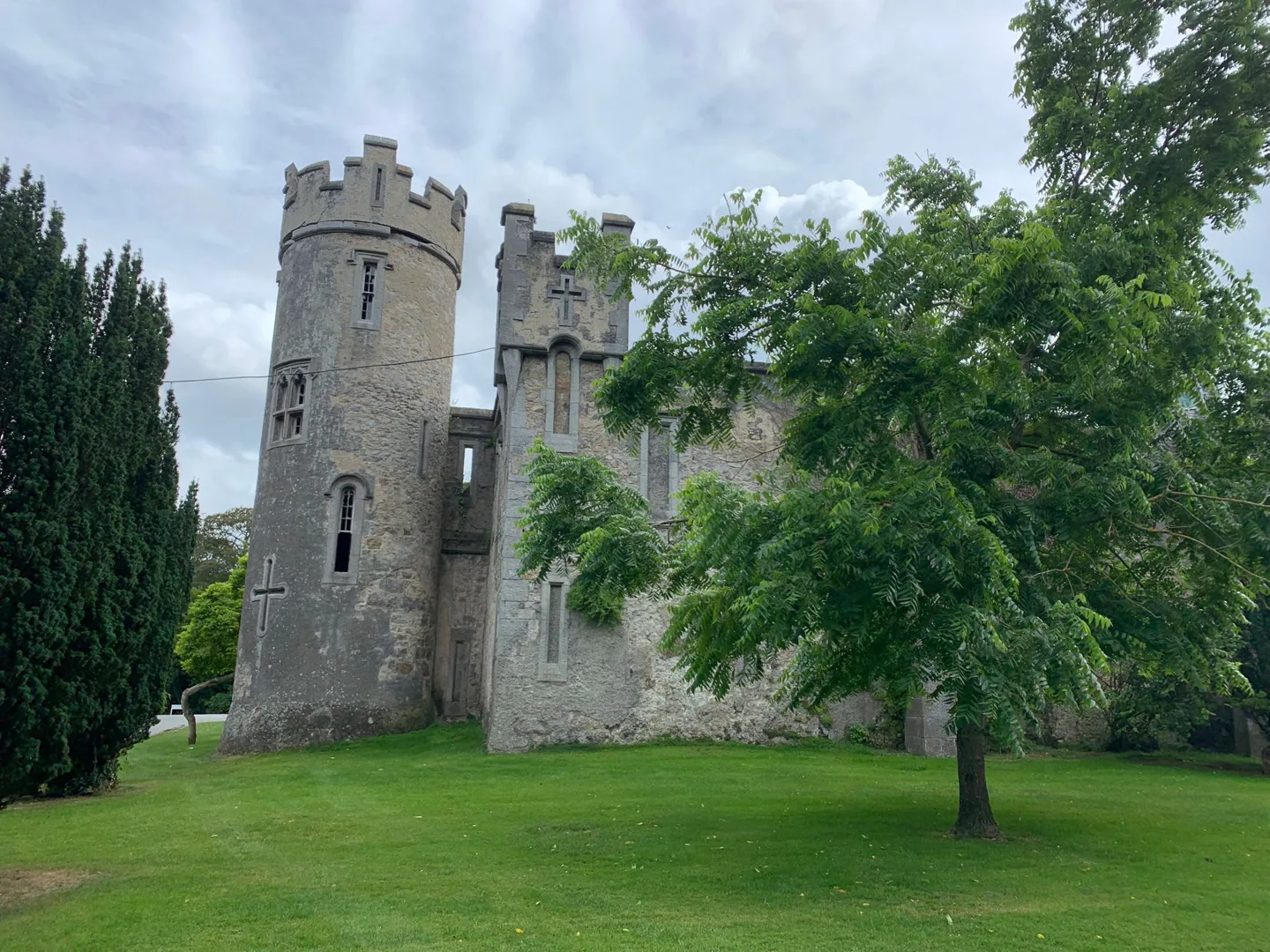 Stone castle beside a green lawn