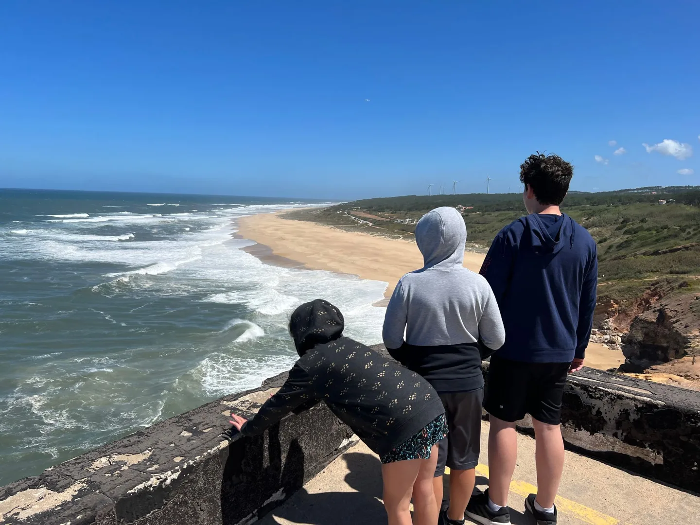 Children at a lookout above the ocean