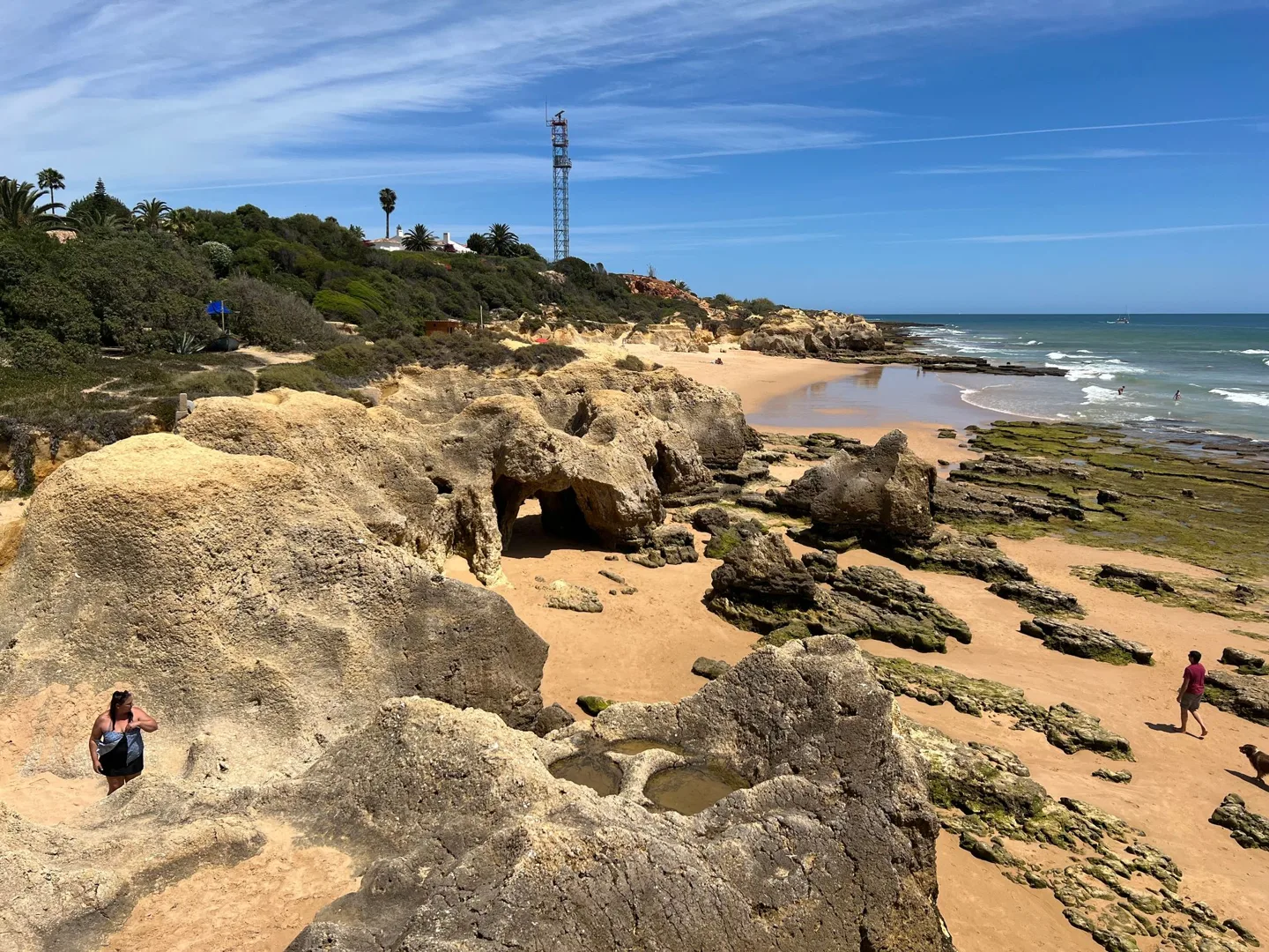 Eroded rocks and sand beside the ocean