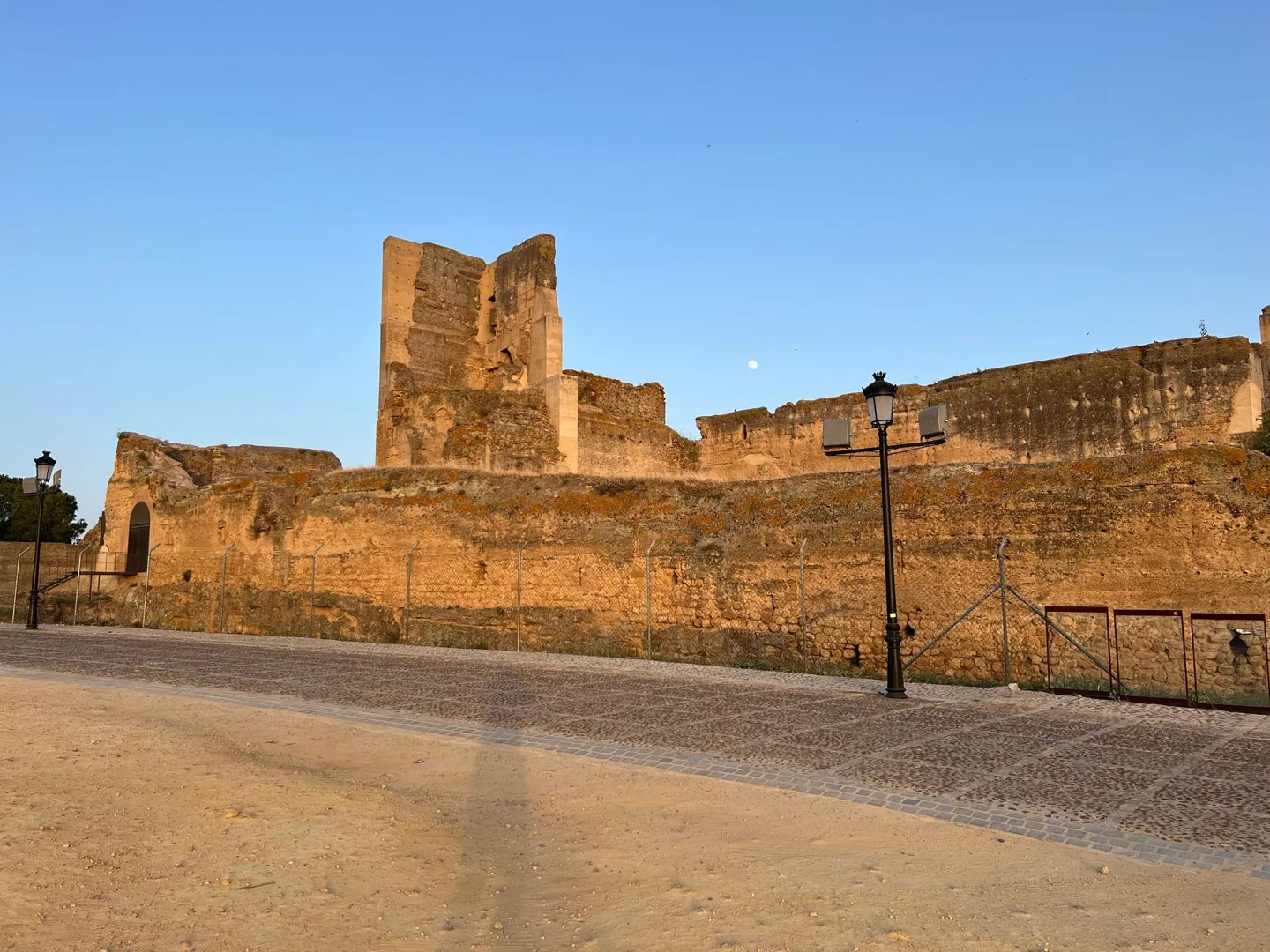 Stone fortress walls in warm evening light