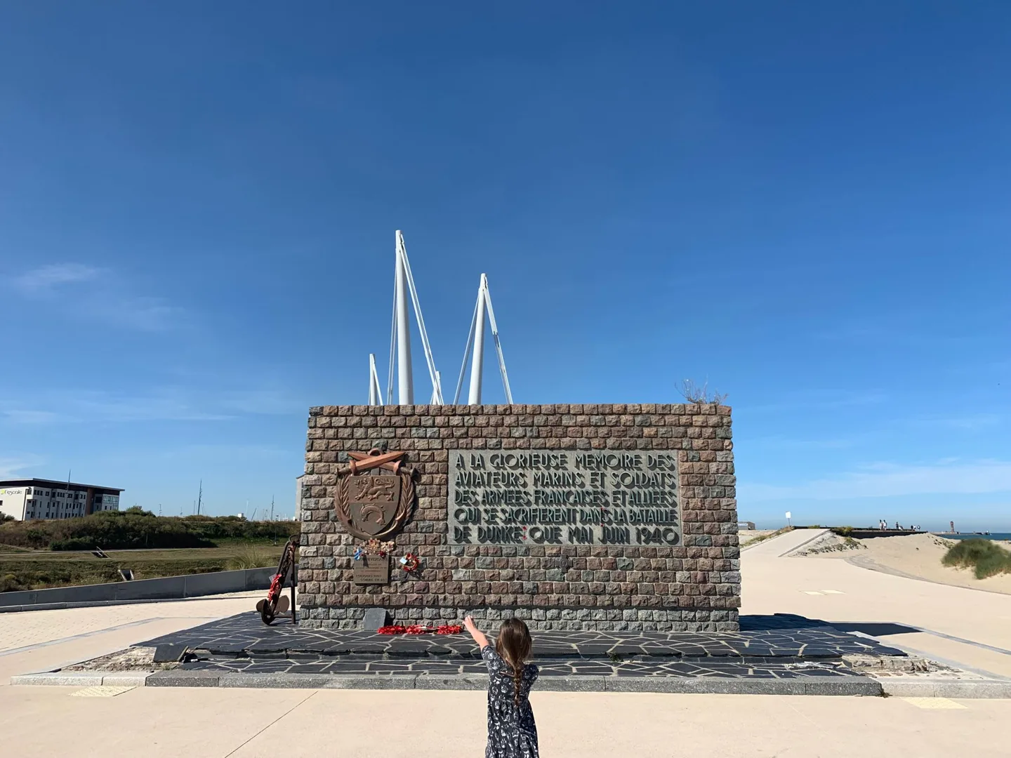 Child beside the Dunkirk evacuation memorial