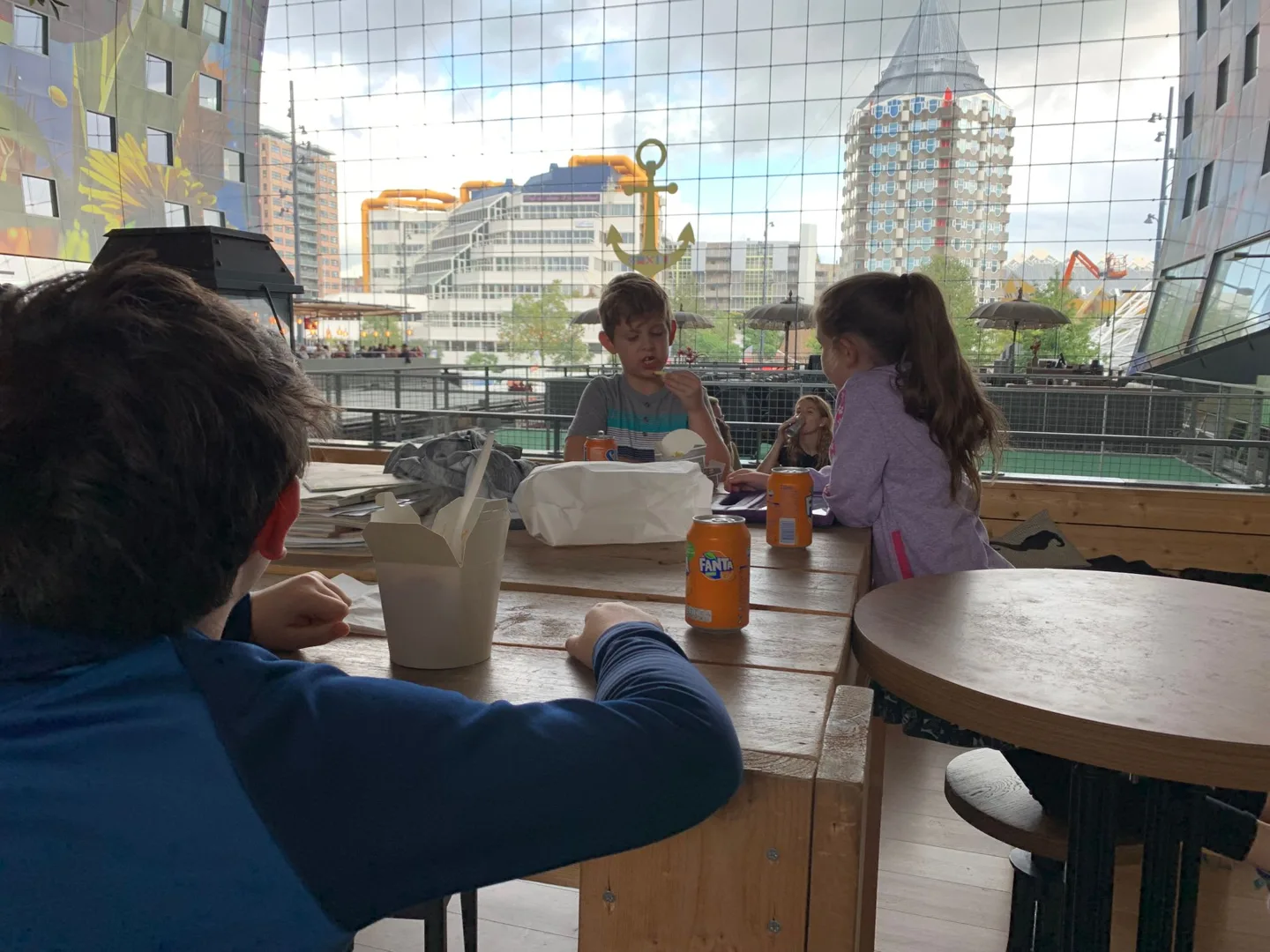Family seated at a café table