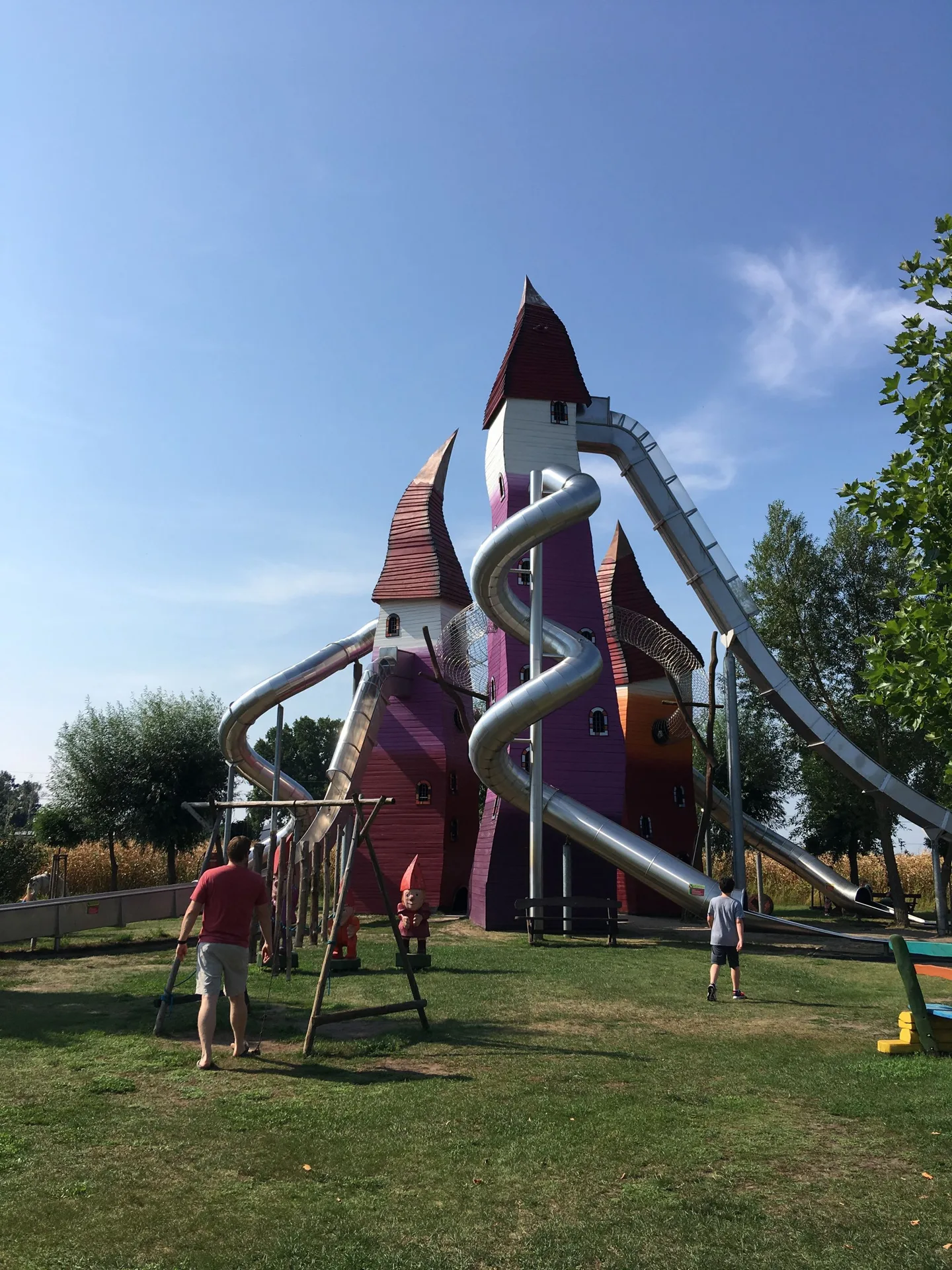 Tall playground slides and towers