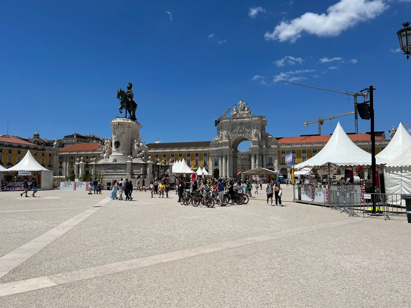 Lisbon square with a statue and outdoor tables