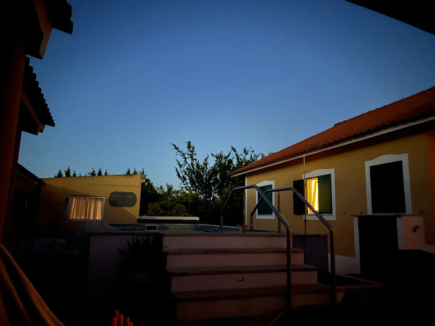 Holiday house and courtyard at dusk