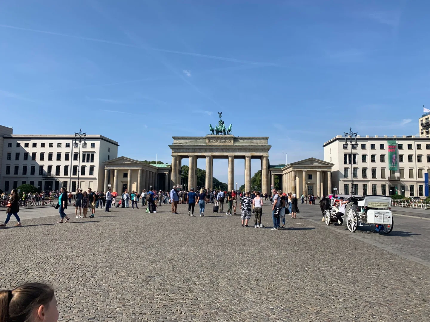 Brandenburg Gate across a crowded square
