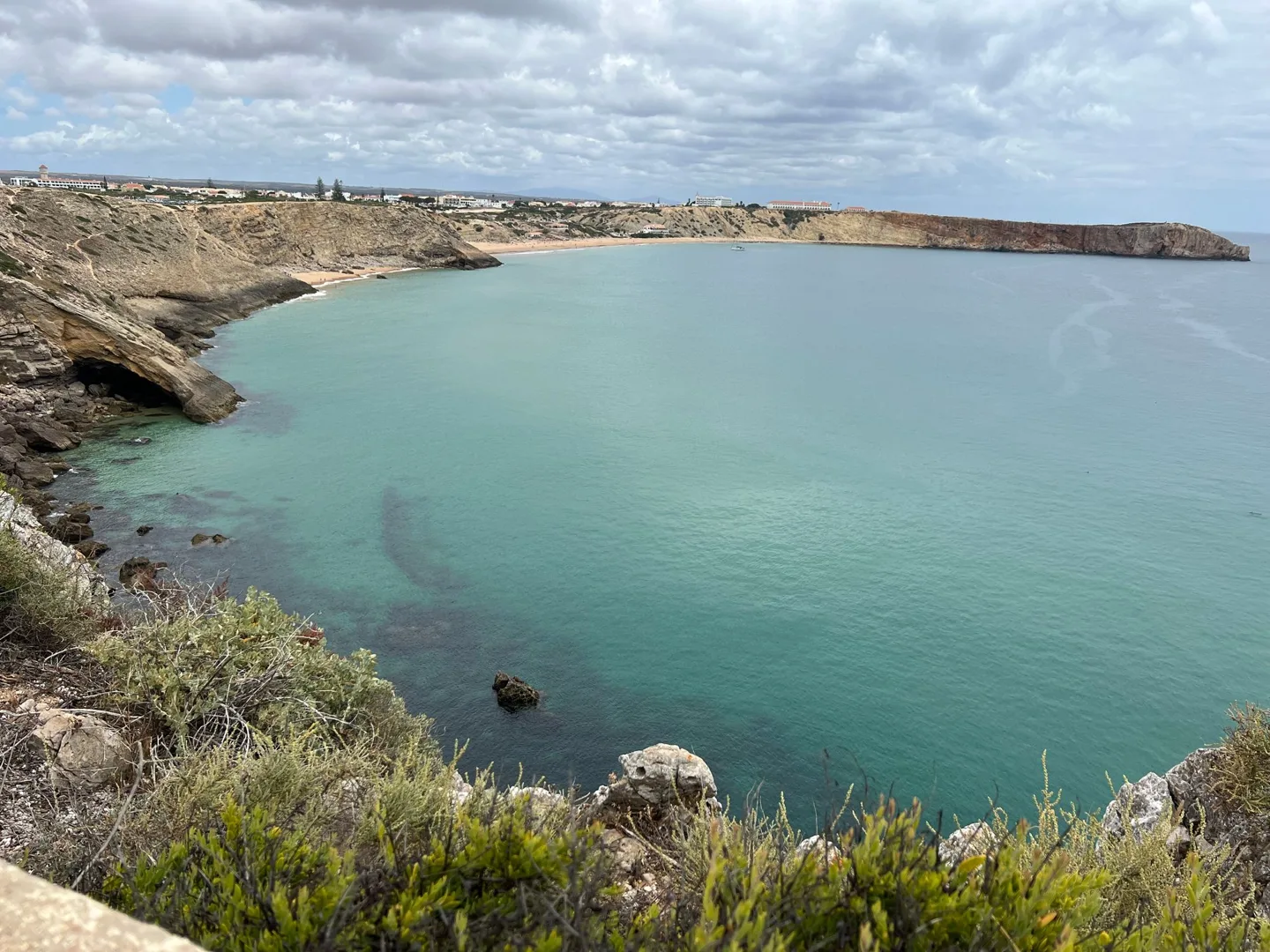 Turquoise bay bordered by cliffs
