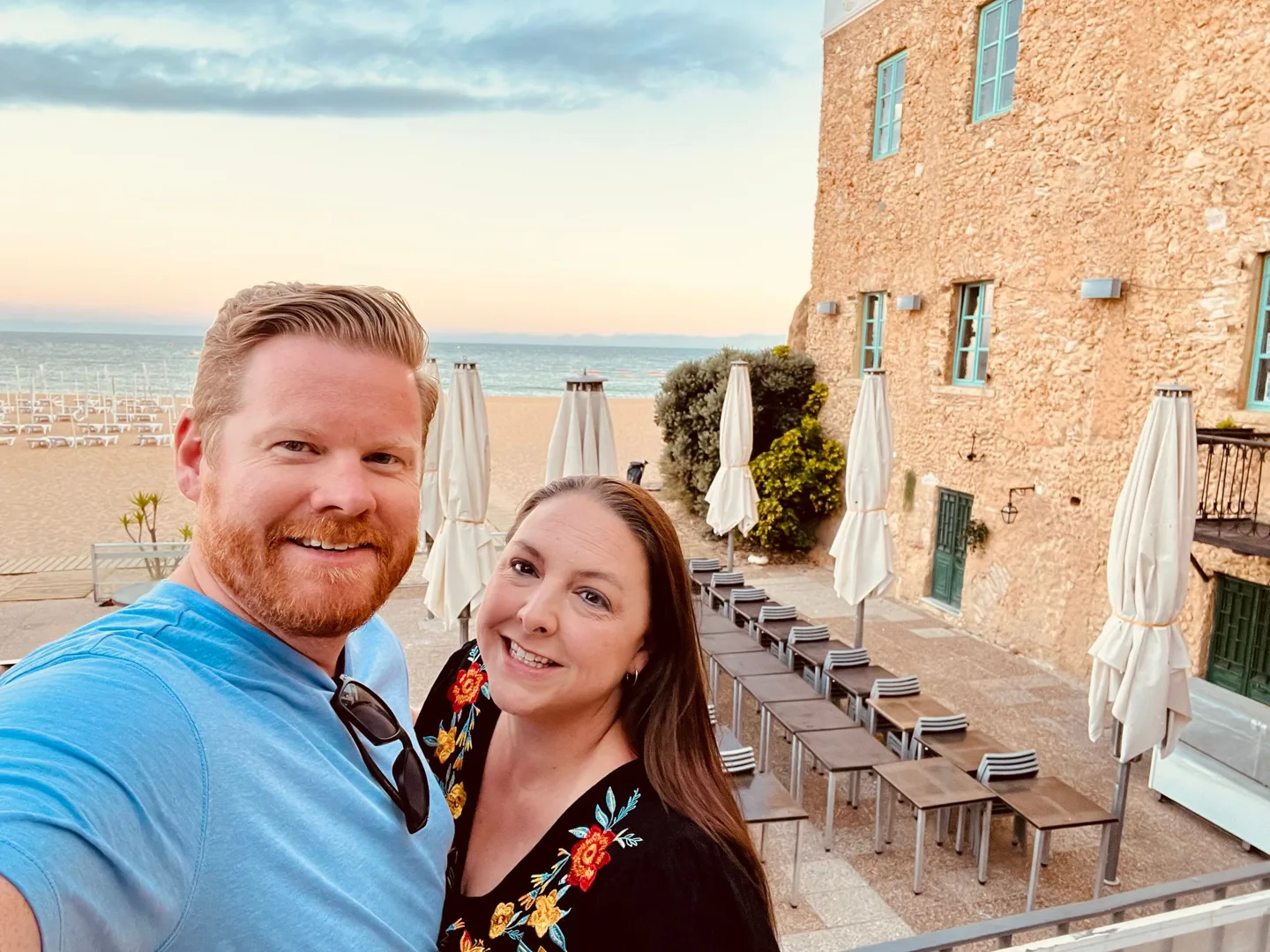 Couple on a seaside terrace at sunset