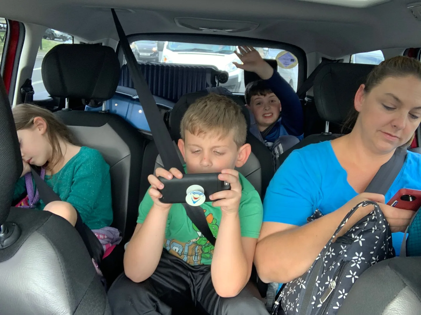 Family seated inside the car