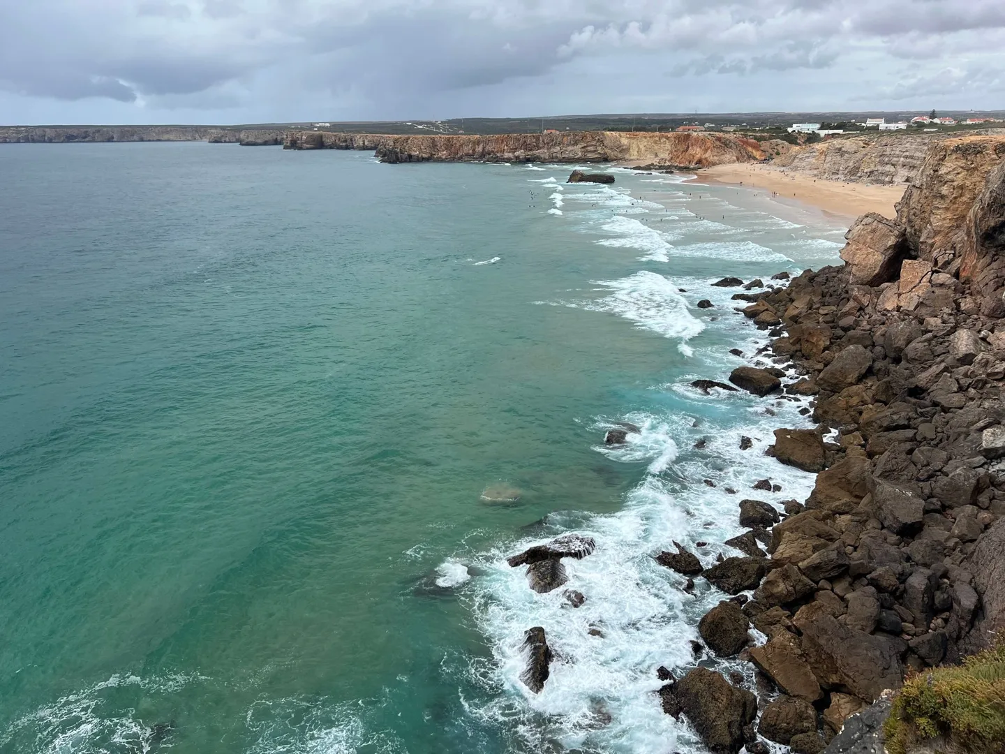 Surf along the base of the cliffs