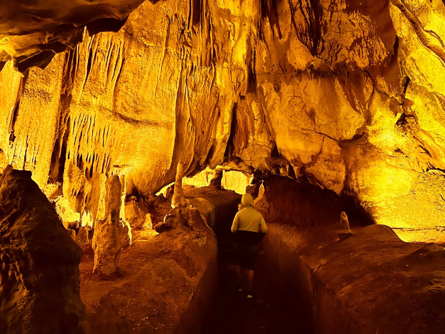 Illuminated cave passage and underground pool
