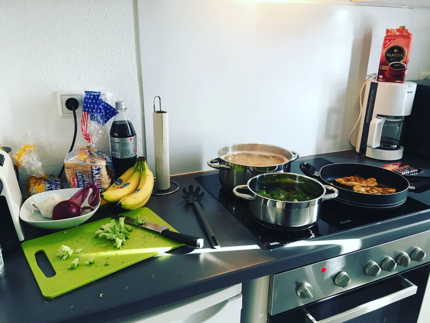 Cooking in a compact apartment kitchen
