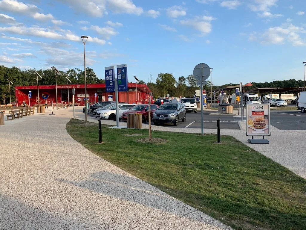 Roadside service area beneath blue skies