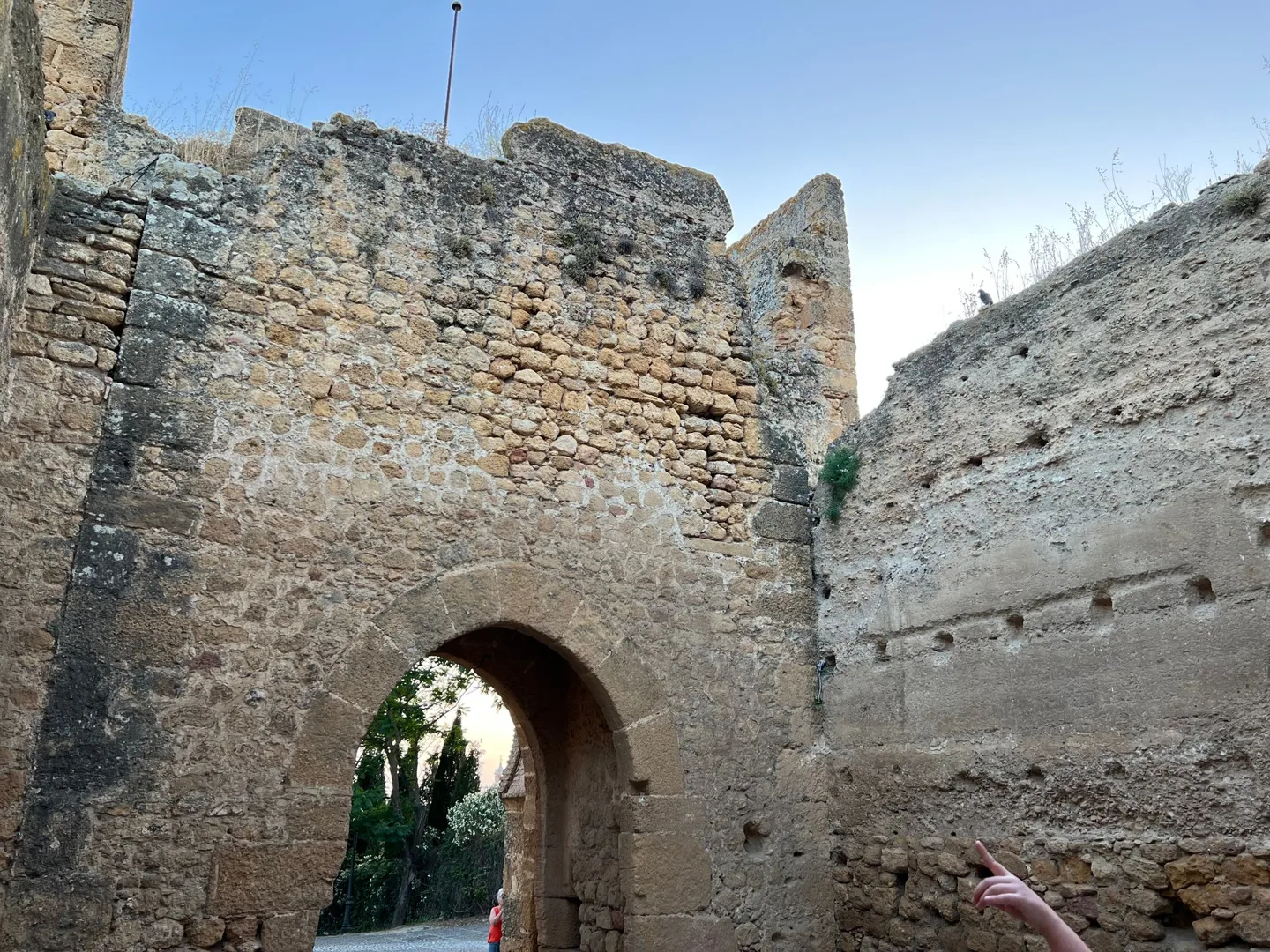 Arched passage through a stone tower