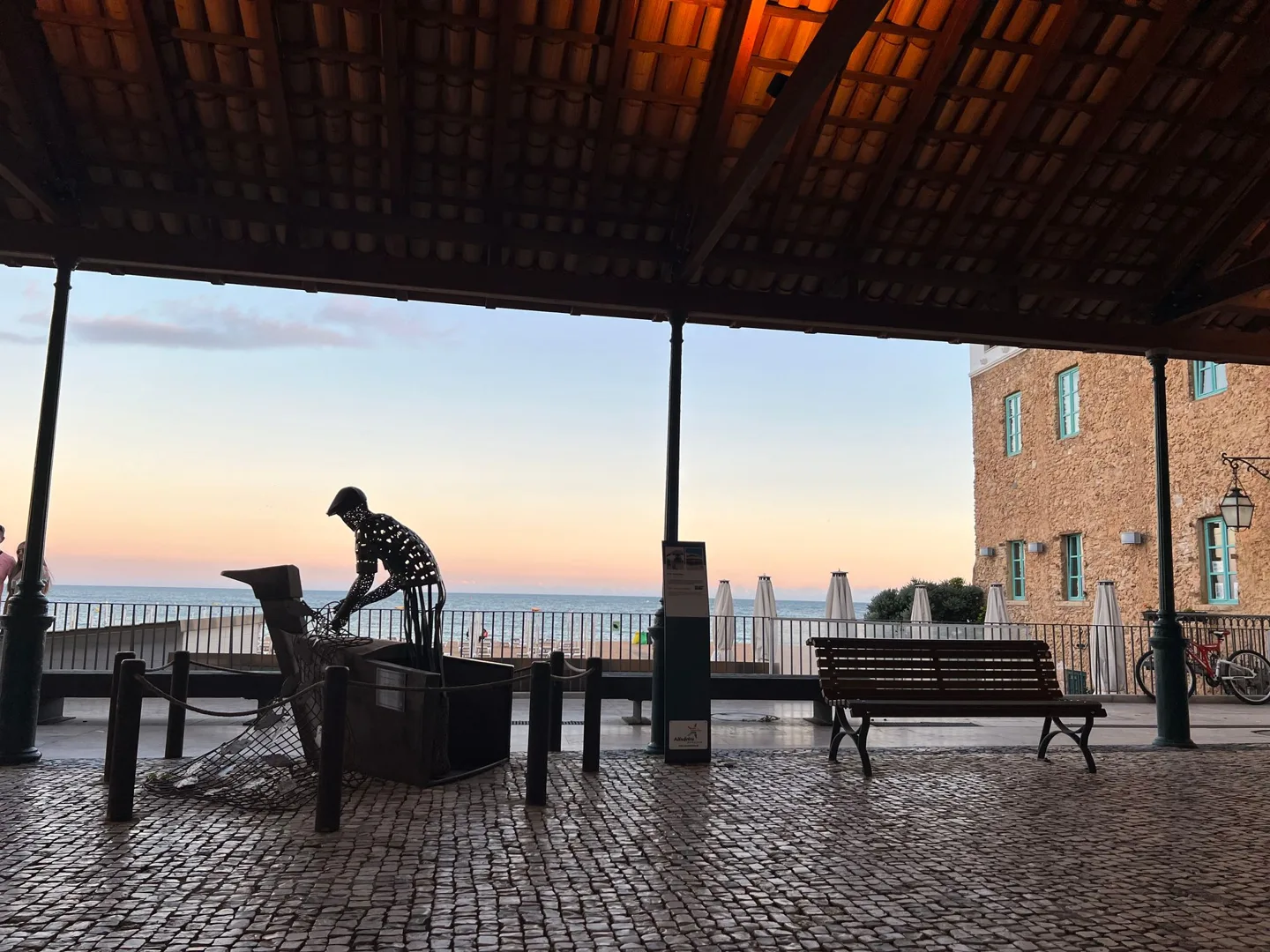 Shaded terrace overlooking the sea at sunset