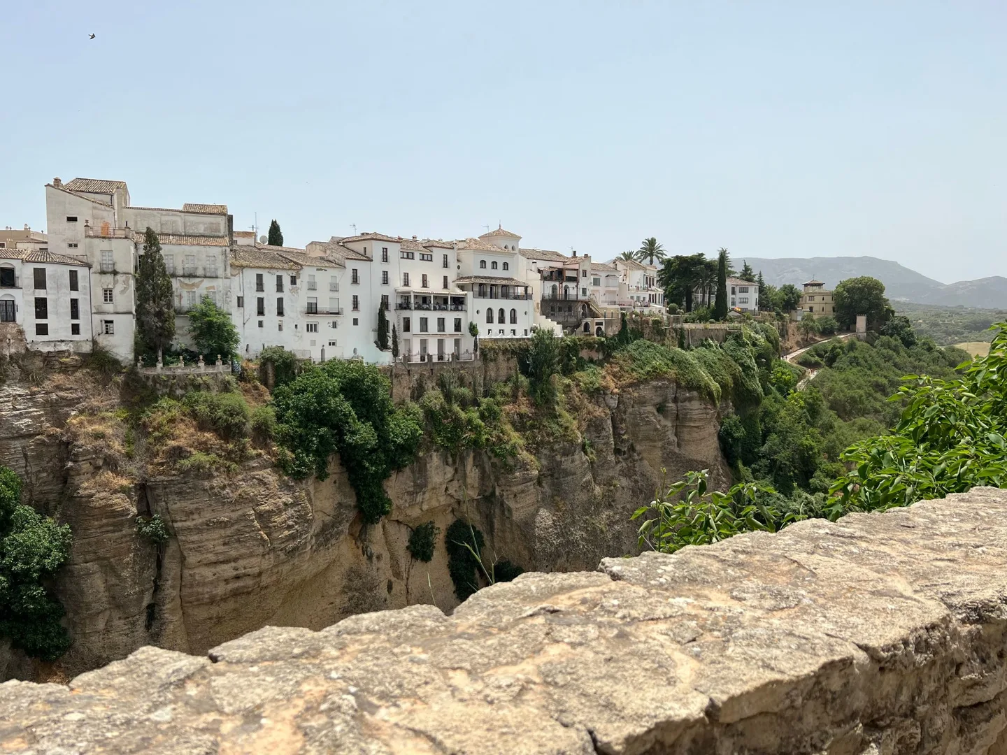 White buildings on the edge of Ronda's gorge